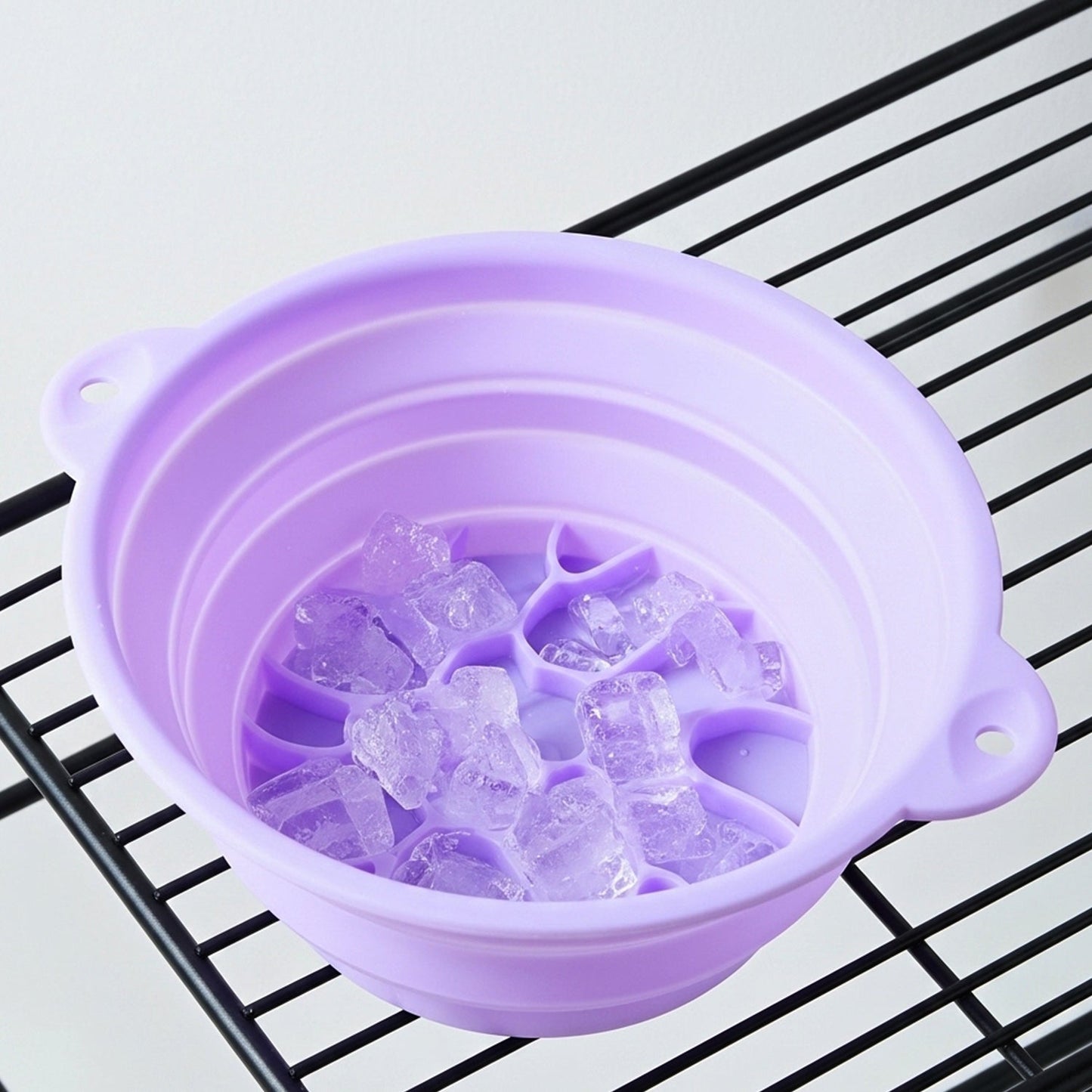 Folded compact silicone facial ice bath bowl ready for storage