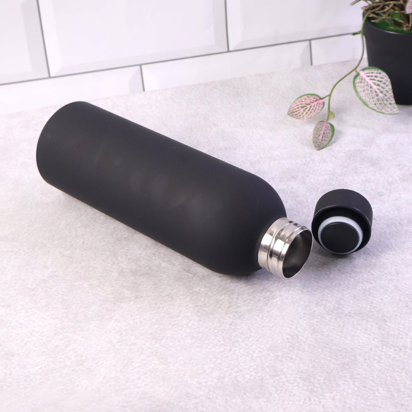 Portable black stainless steel hydration bottle with leak-proof cap