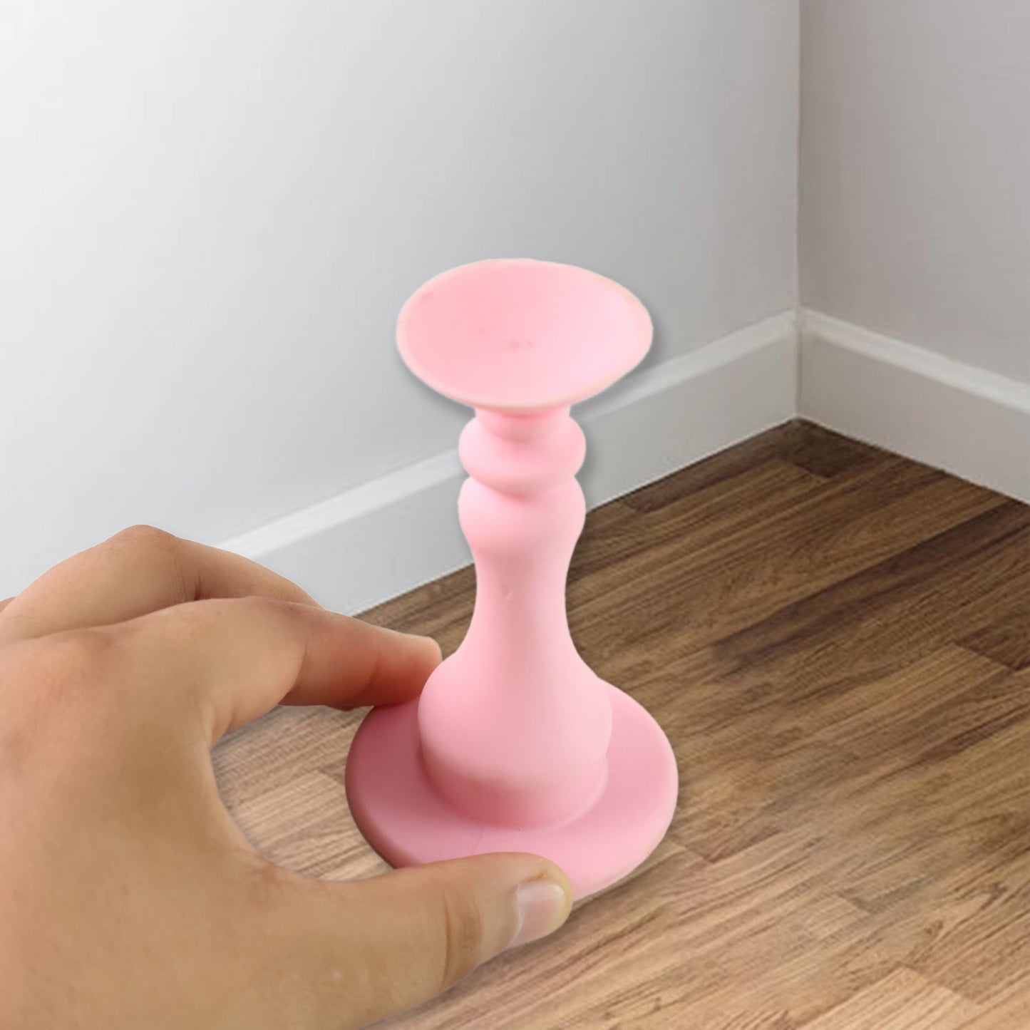 Flexible pink washing machine door stopper protecting washer gasket