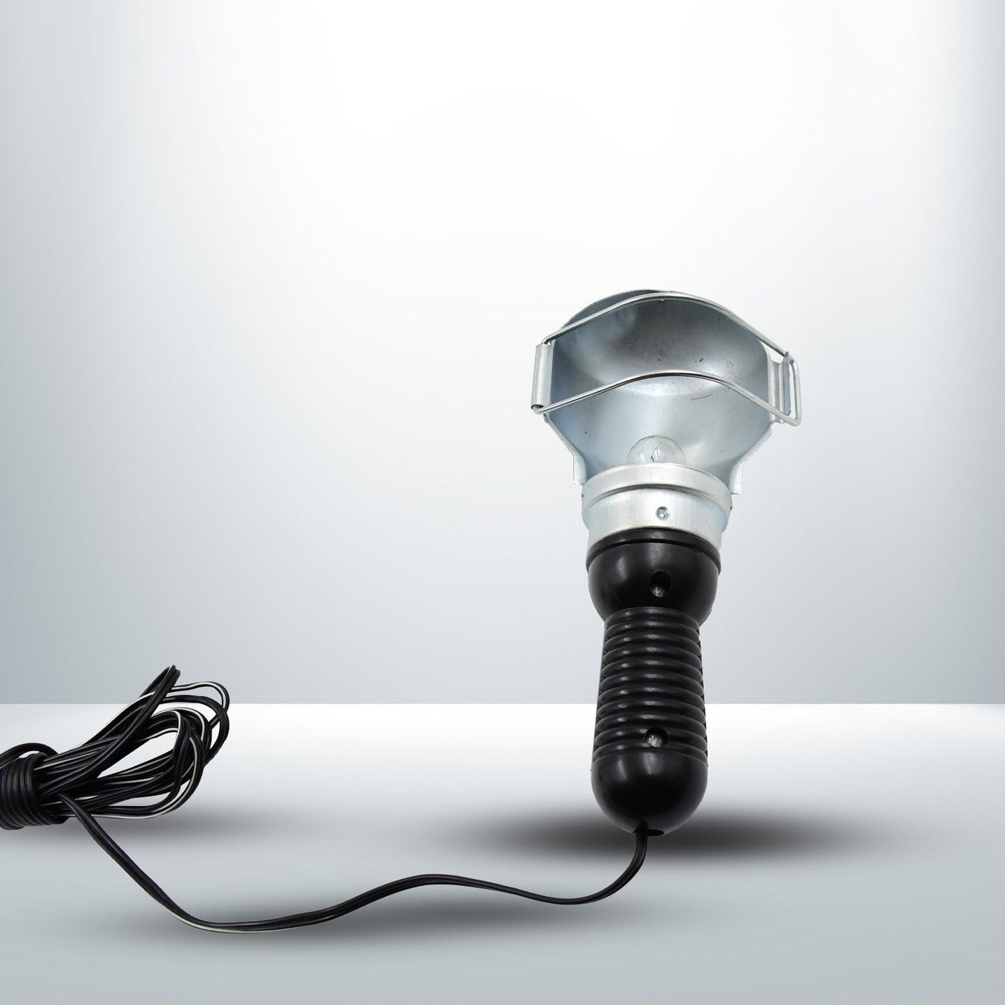 The Portable Work Lamp placed on a surface, highlighting its stable base.
