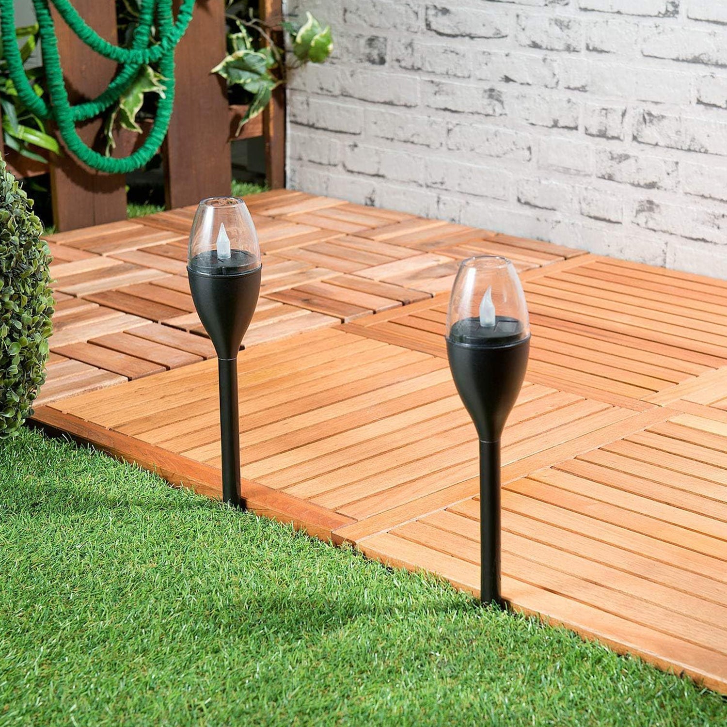 Side profile of solar-powered outdoor garden light on stake