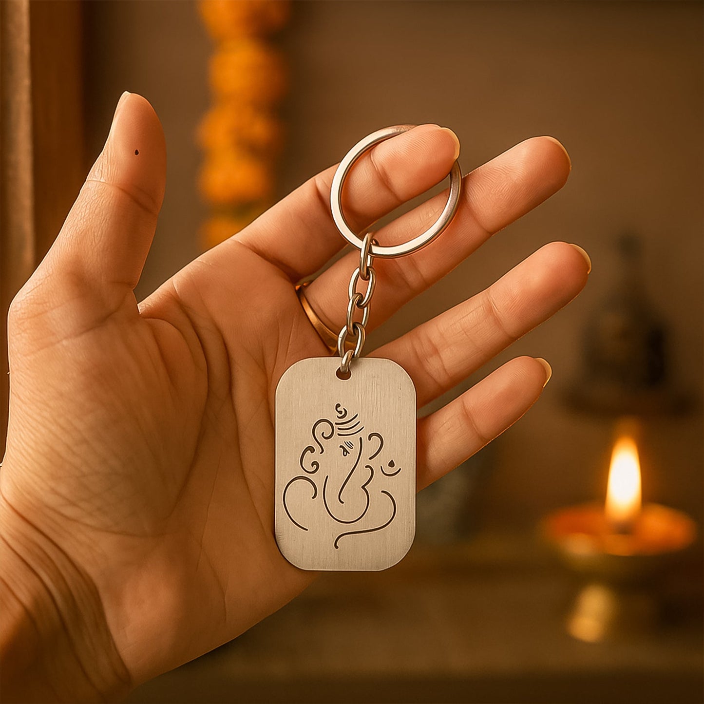 Close-up view of the intricate Shree Ganesh charm on the durable metal keychain.