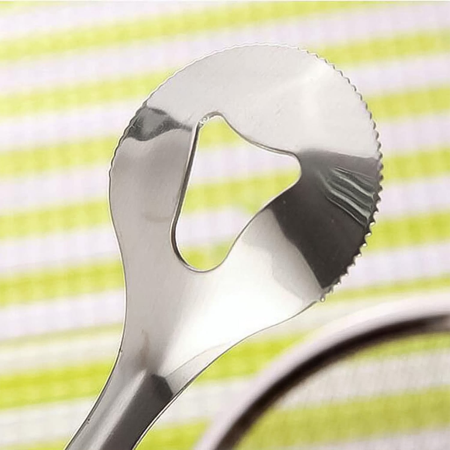 Angled view of the durable stainless steel frying filter spoon.