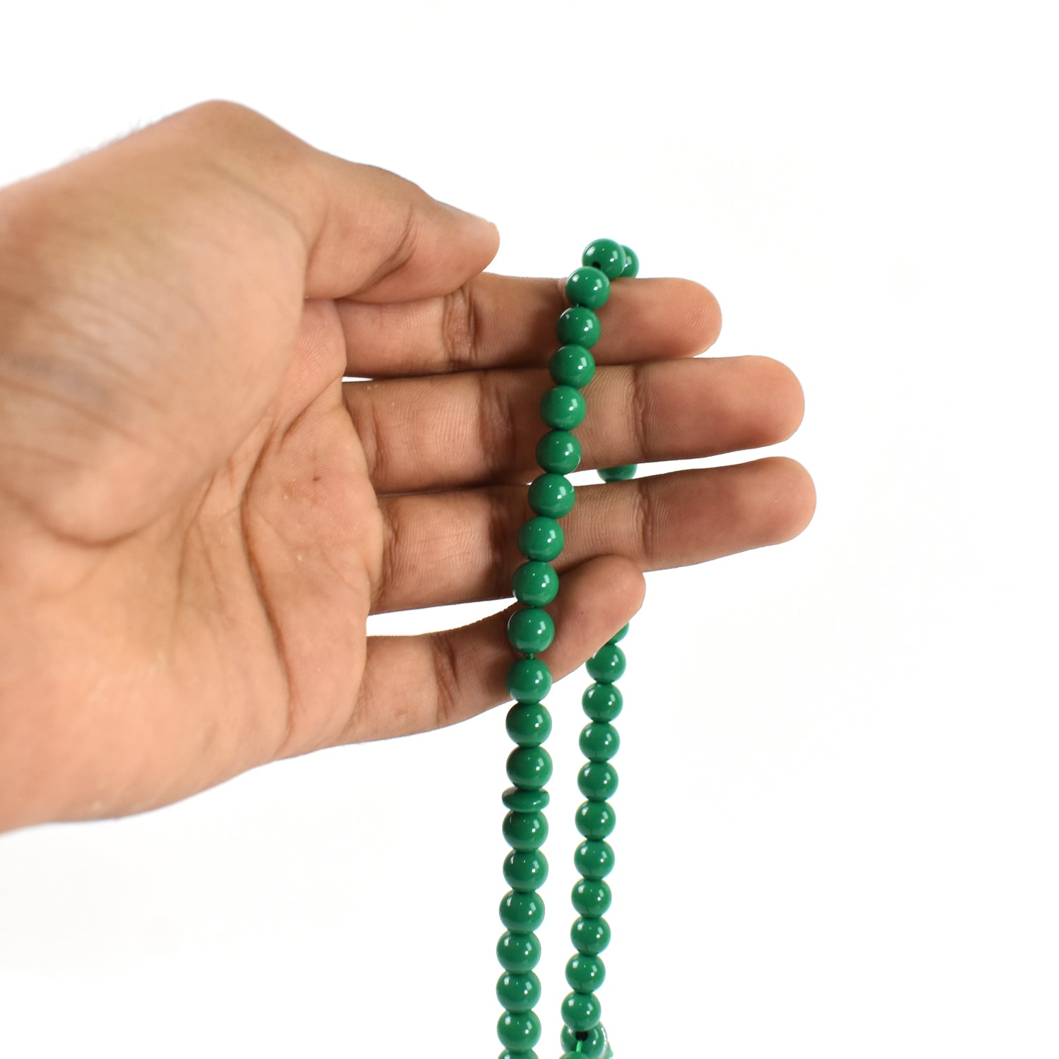 Detailed view of the tasbih beads and small bag, perfect for spiritual reflection during Umrah.