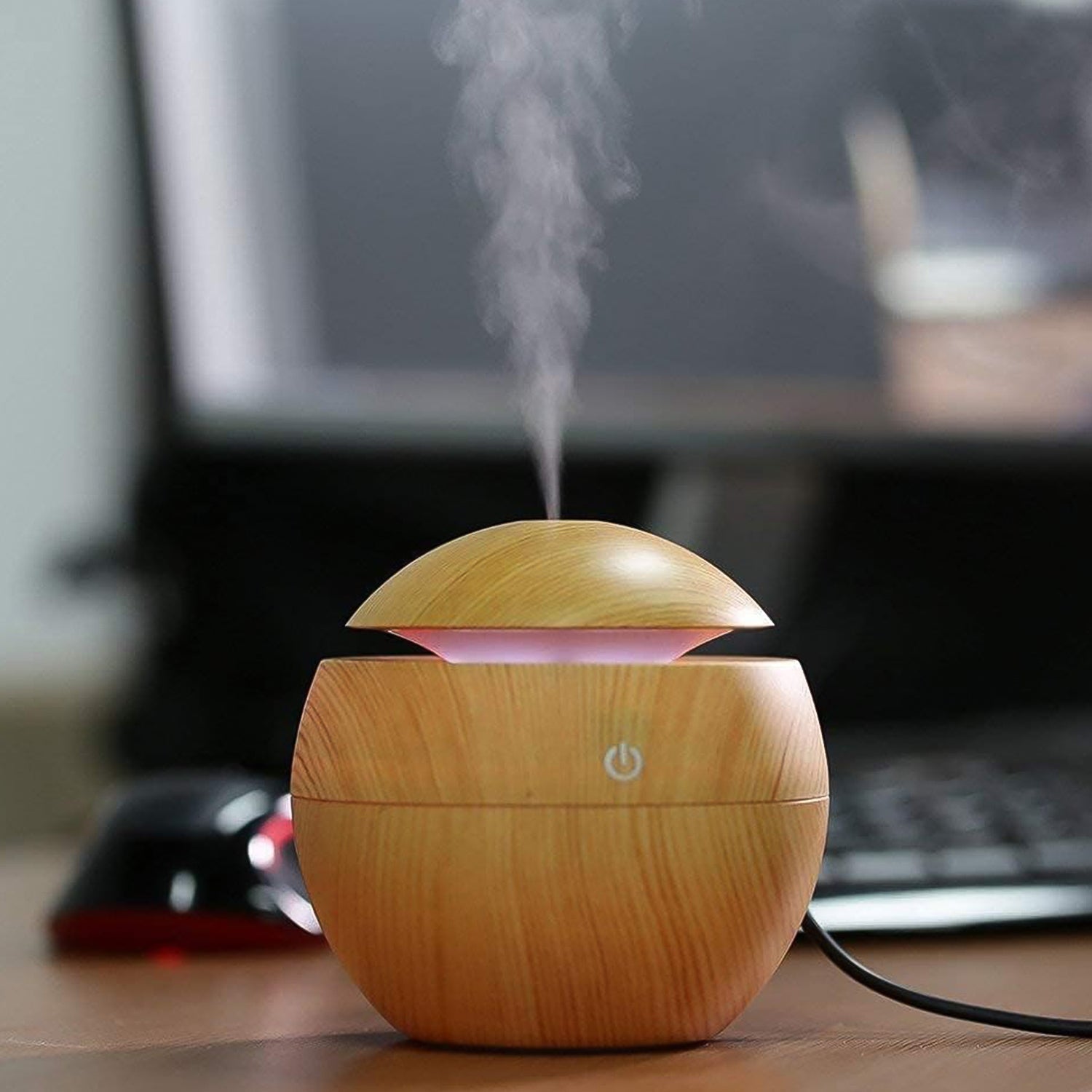 Side view of the USB desktop humidifier, showcasing its sleek design.