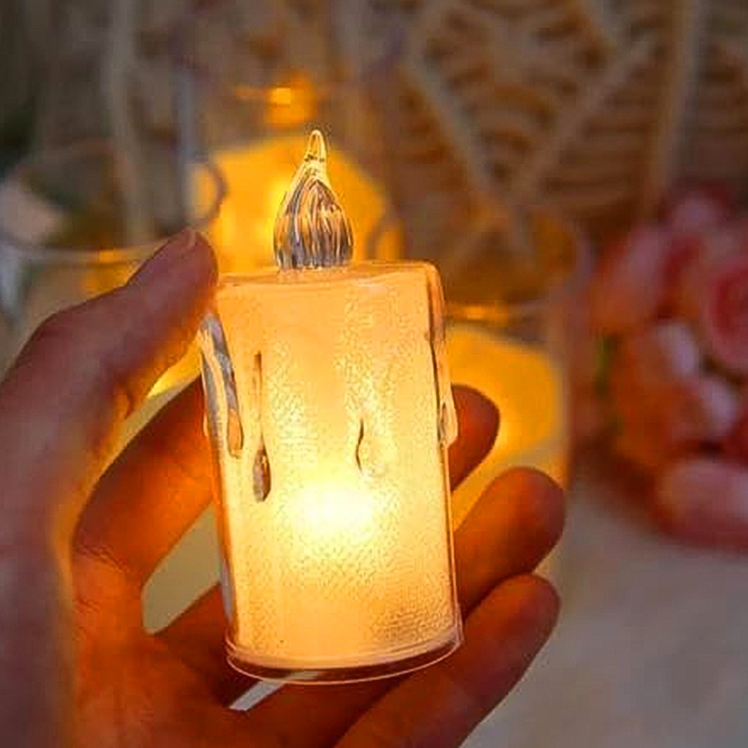 Hand holding a smokeless, odourless LED candle, perfect for safe home decor.