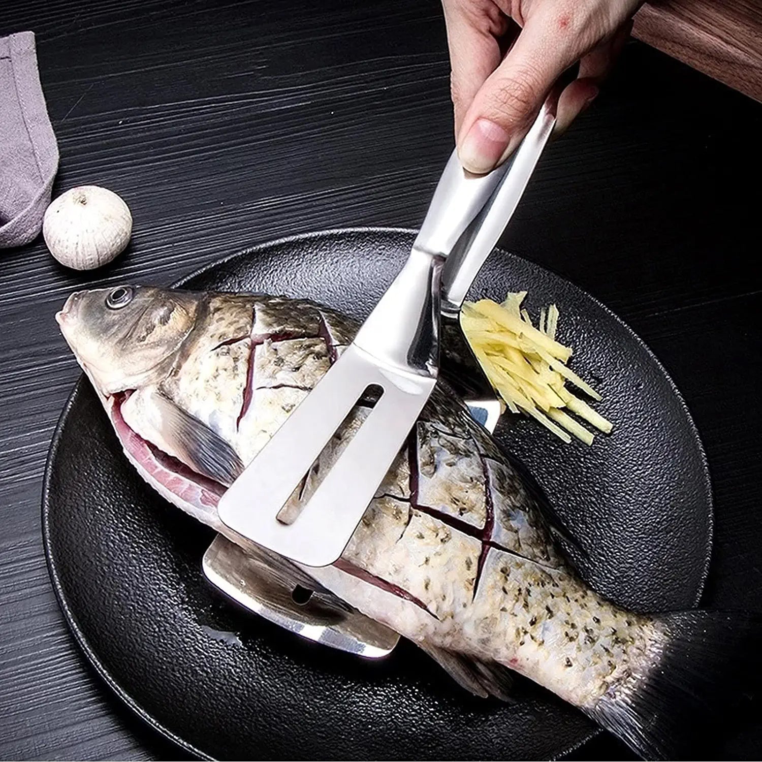 Quickslice stainless steel BBQ tongs with secure clip mechanism.