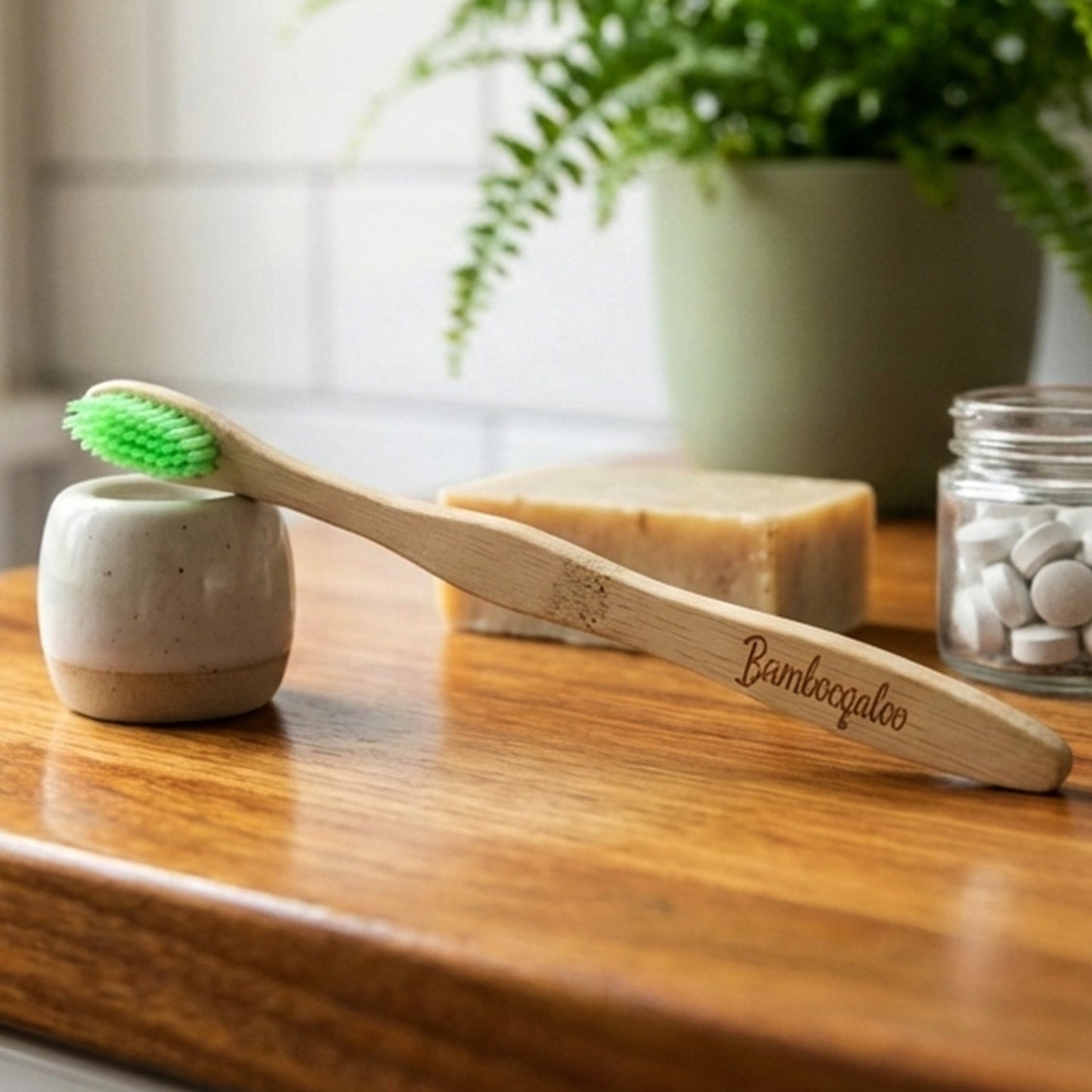 Close-up image of the bamboo toothbrush set showing soft bristles