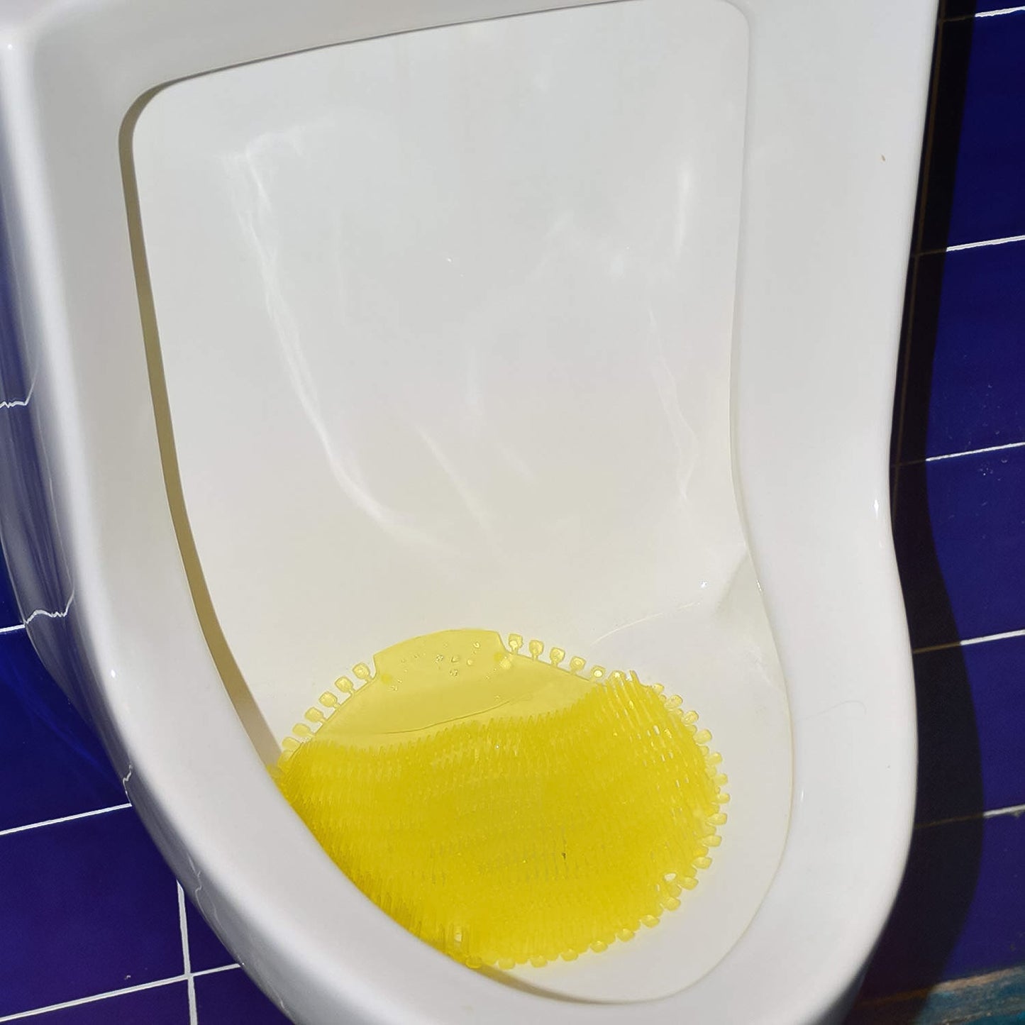 Urinal screen deodorizer mat designed to prevent splashes and control odors in men’s washrooms