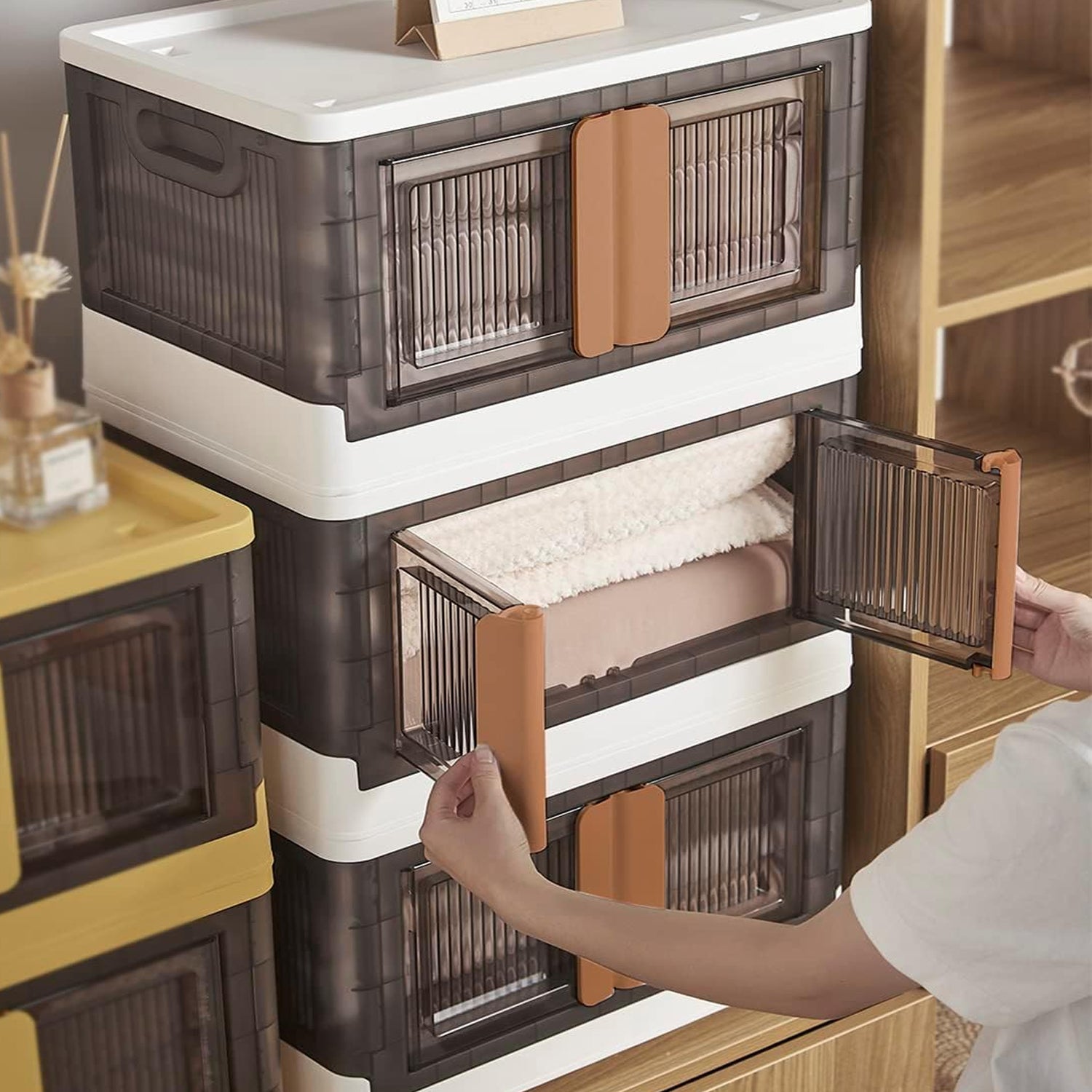 Space-saving plastic folding closet storage unit with moveable wheels