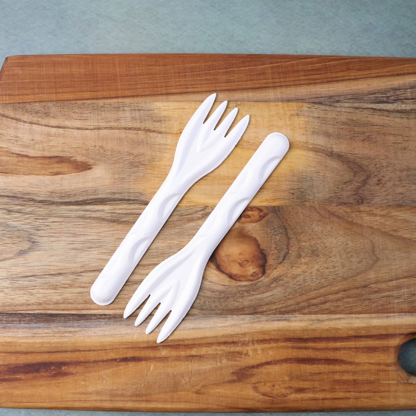 Close-up of single compostable bagasse fork highlighting sturdy design