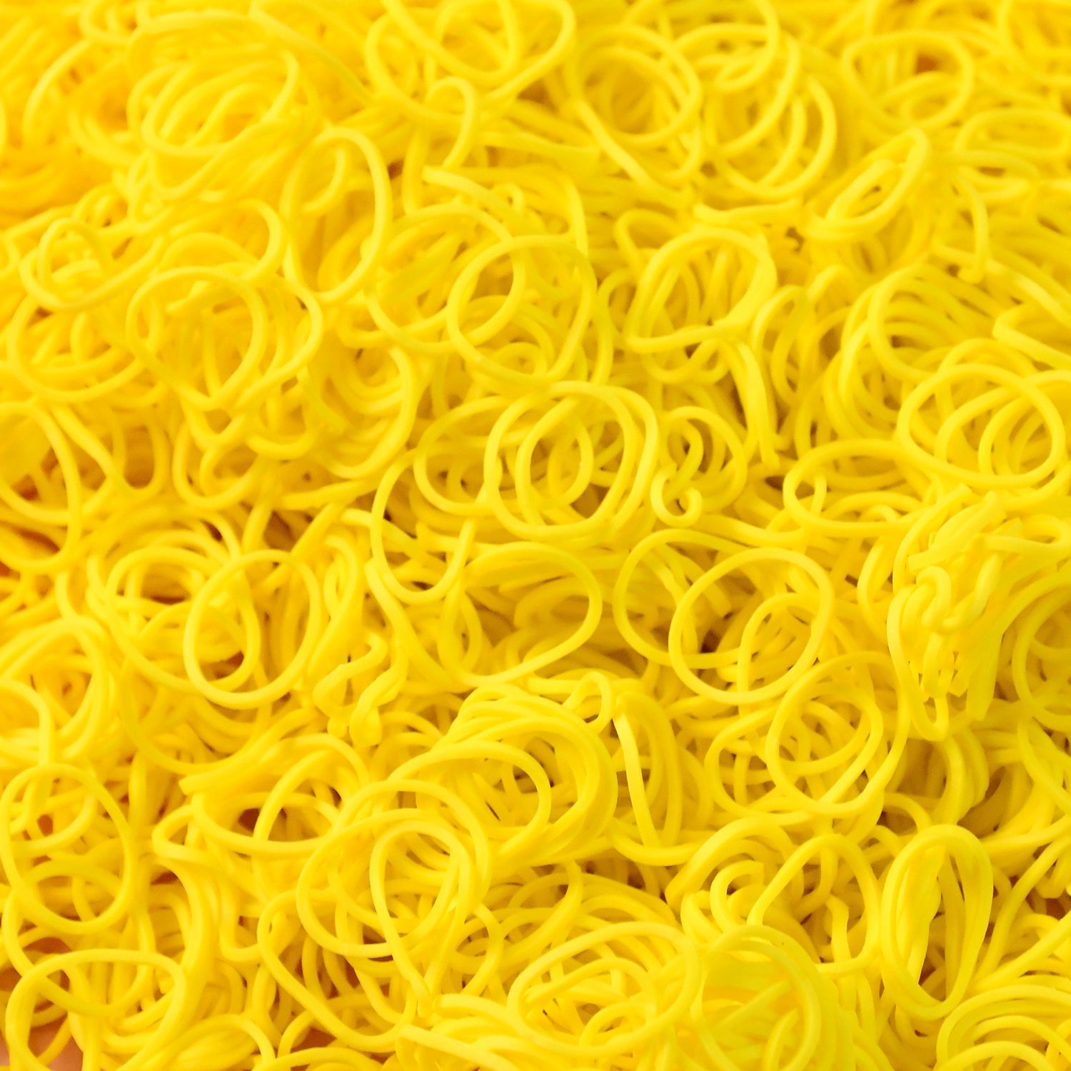 Close-up of durable elastic rubber bands in bright orange