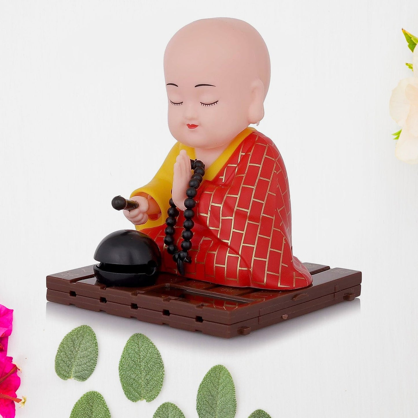 Back view of the solar Buddha statue, showing the solar panel for eco-friendly power.