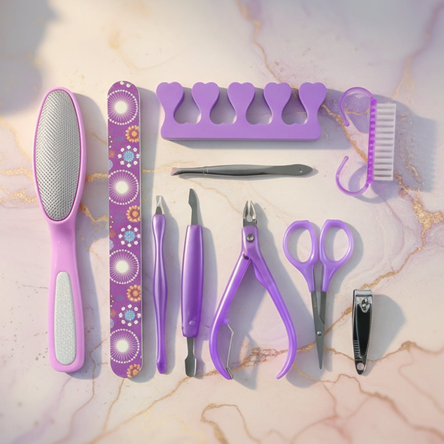 Stainless steel manicure and pedicure tools arranged neatly in the grooming set