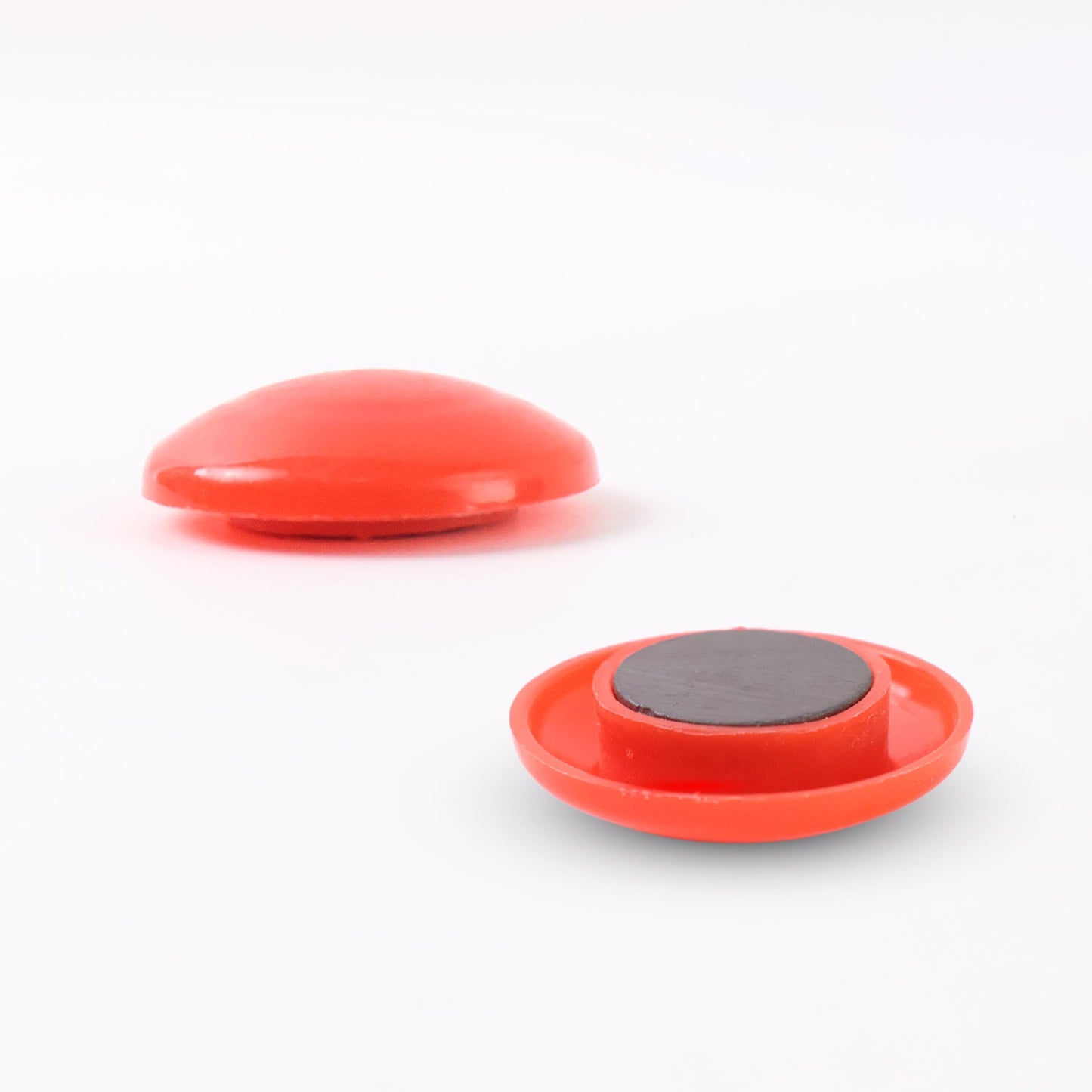 Easy-to-remove red magnetic board dots holding important notes