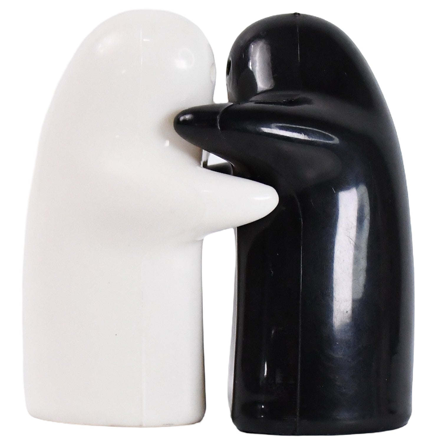 Ceramic salt and pepper shakers placed on dining table setup