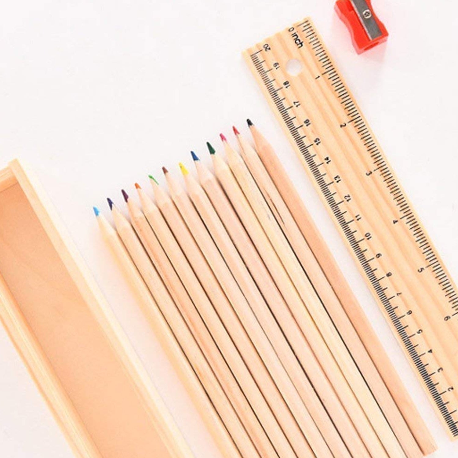The wooden ruler and the colorful pencil box, essential accessories from the art kit.
