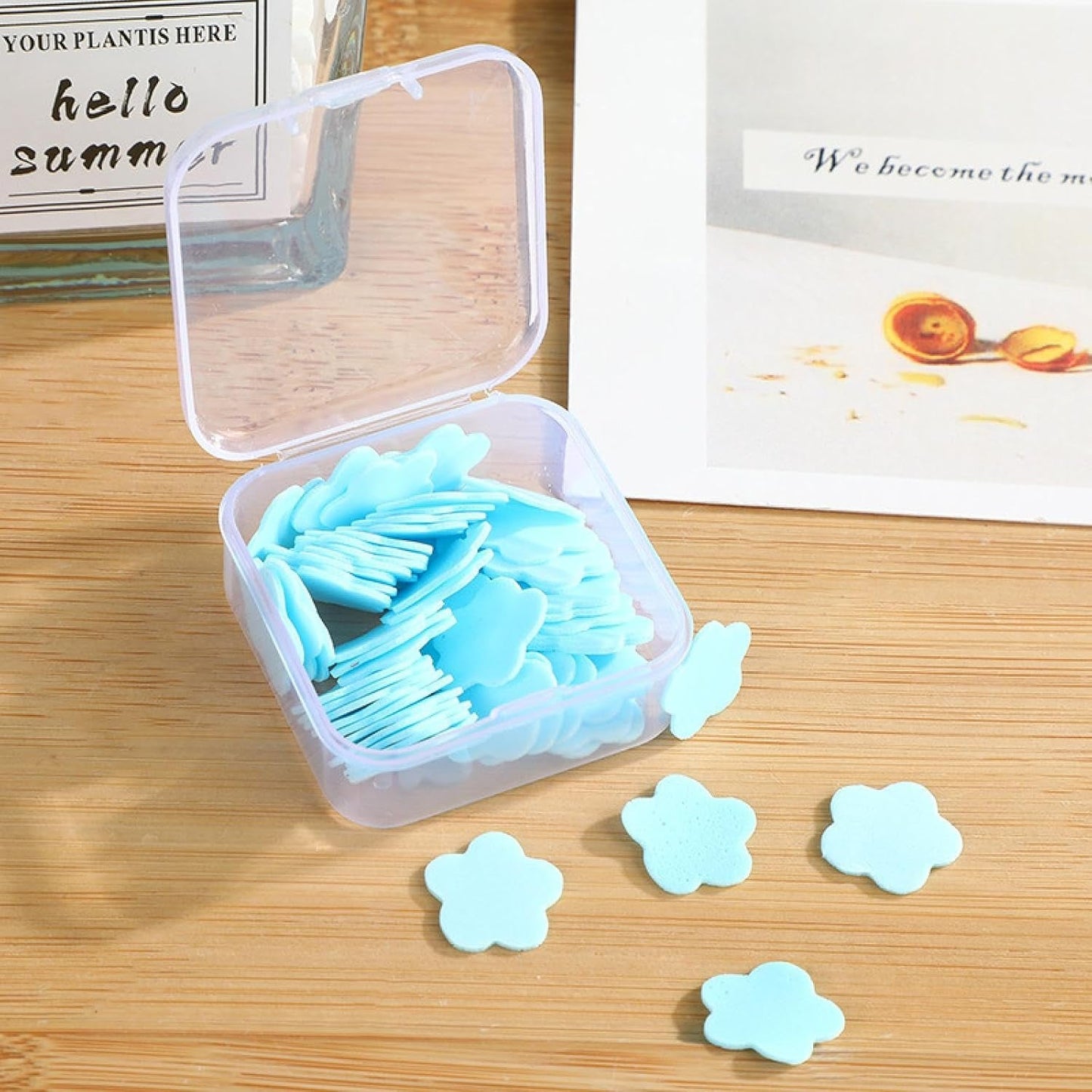 Multiple colourful packs of mini travel soap paper sheets displayed together.