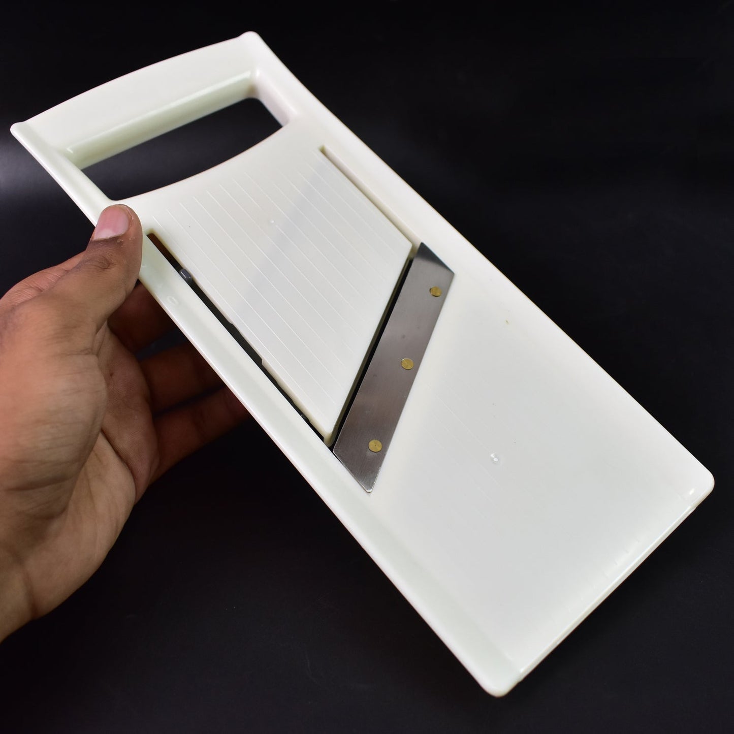 Adjustable slicer kitchen gadget with its sturdy plastic body on a counter.