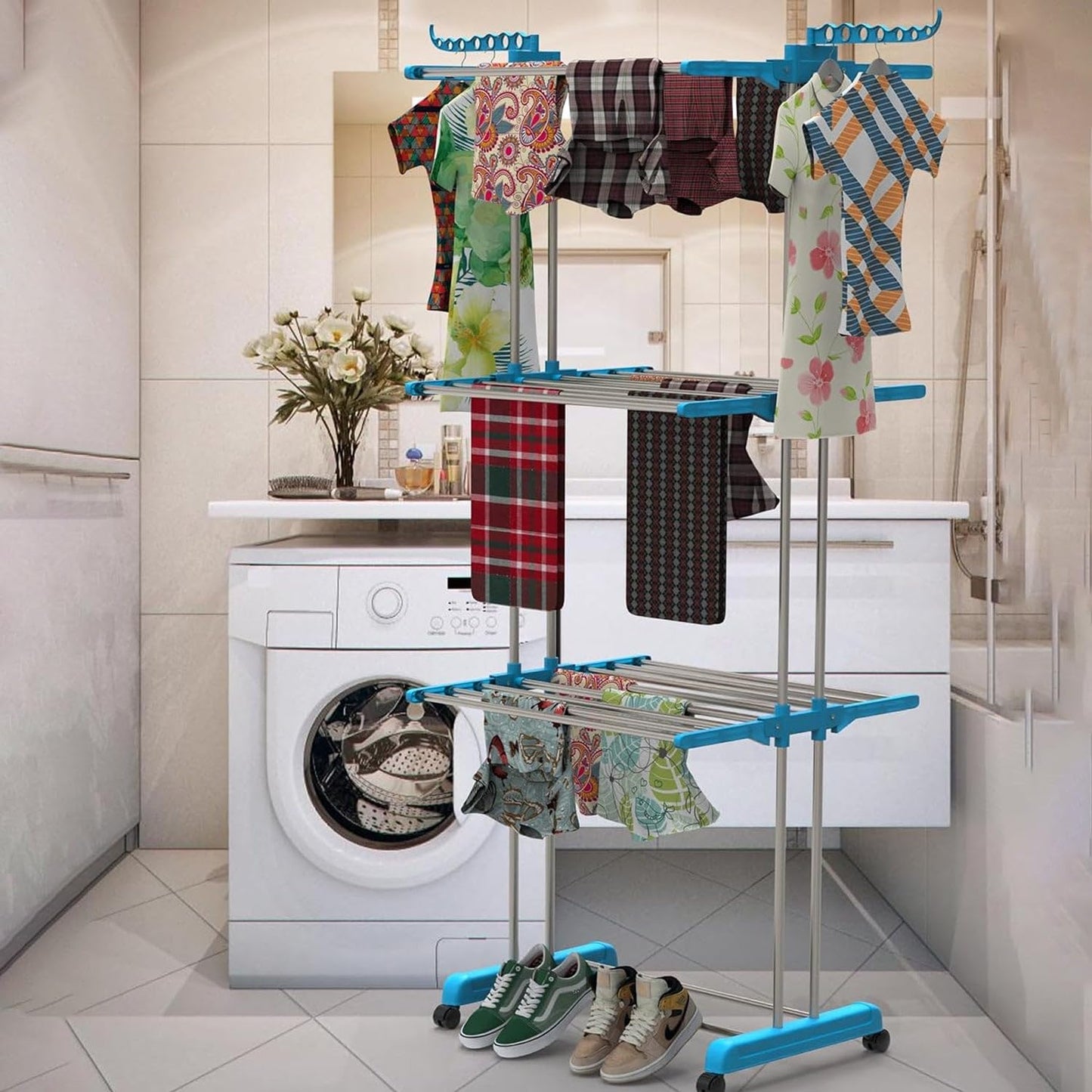 Indoor clothes drying stand in use, air-drying towels and various garments.