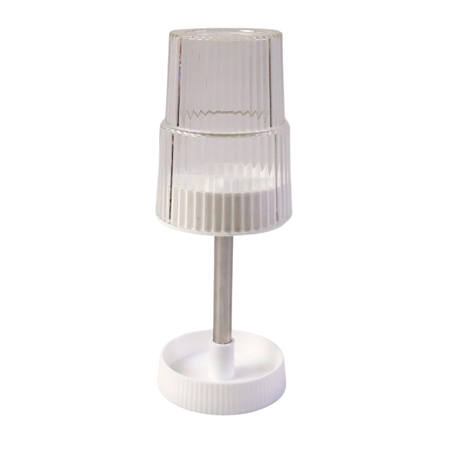 Storage slots of rotating toothbrush holder stand holding toothbrush and toothpaste
