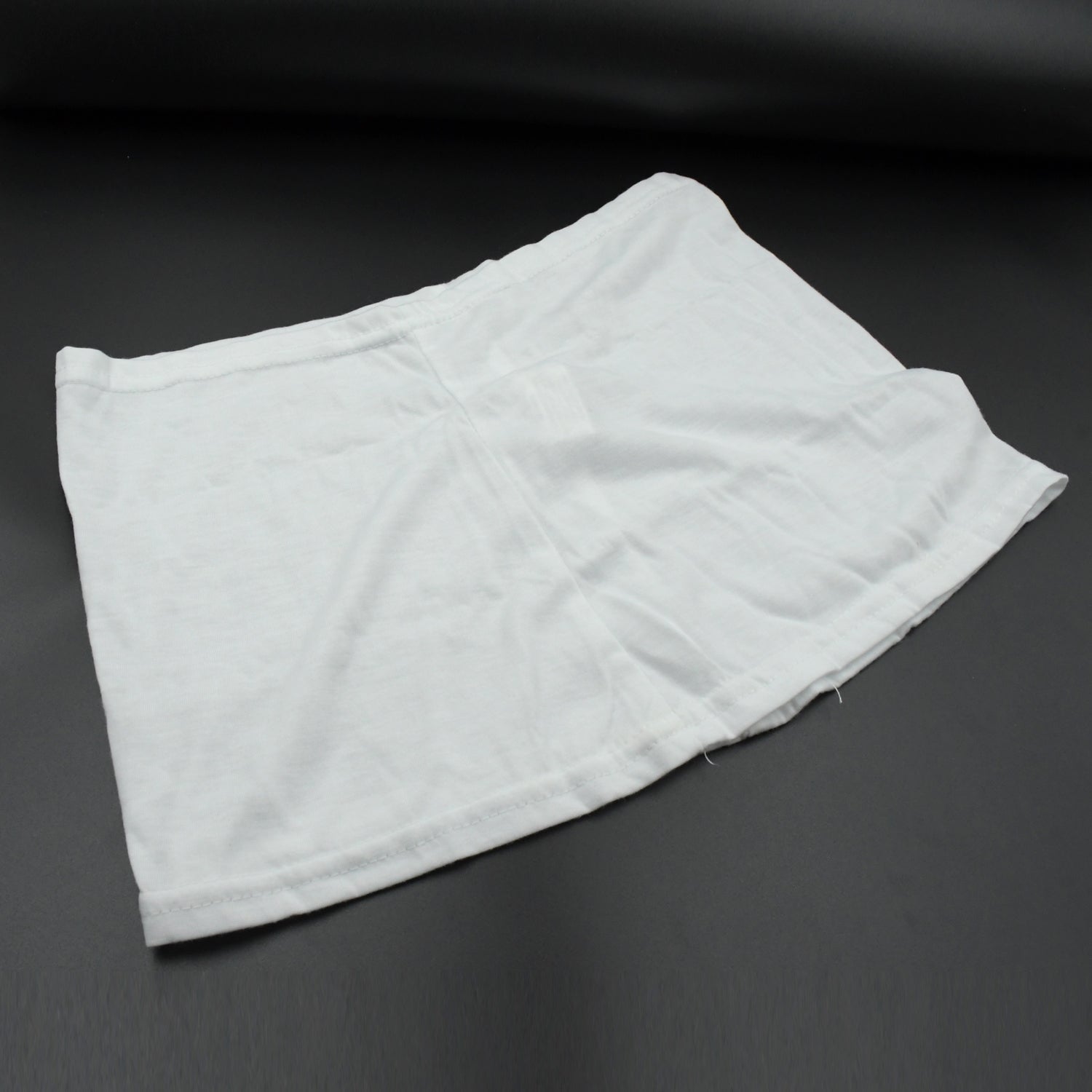 Women's high-waisted athletic skort front view in white.