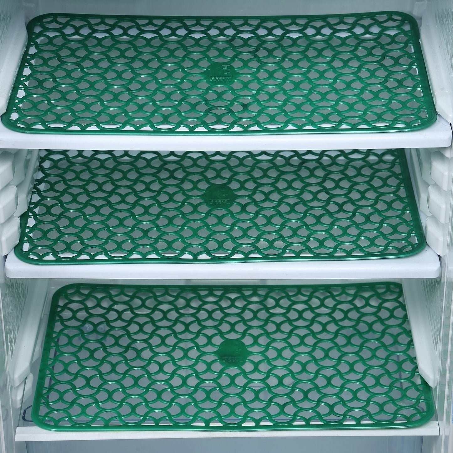 Fridge drawer mats preventing spills and scratches.