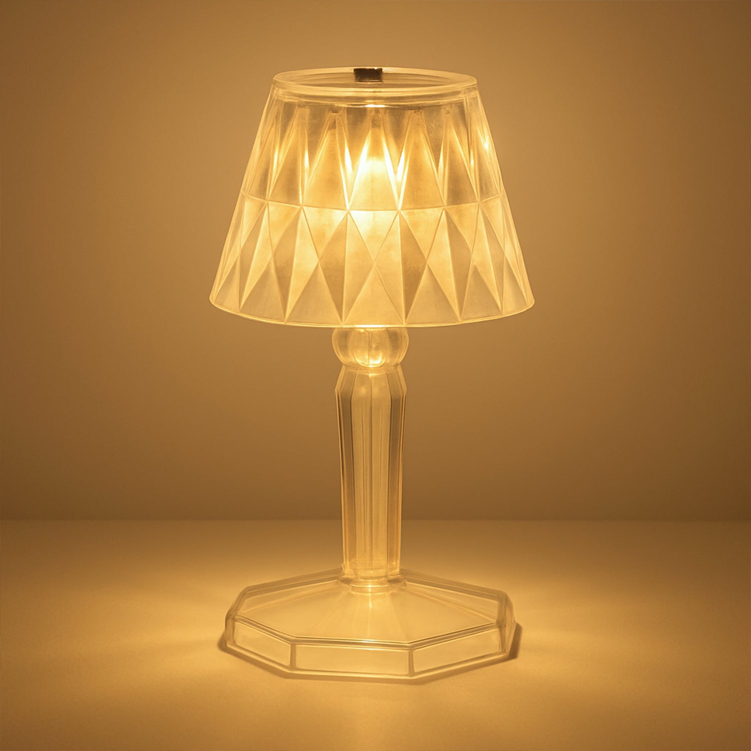 A detailed view of the acrylic crystal table lamp on a wooden surface.