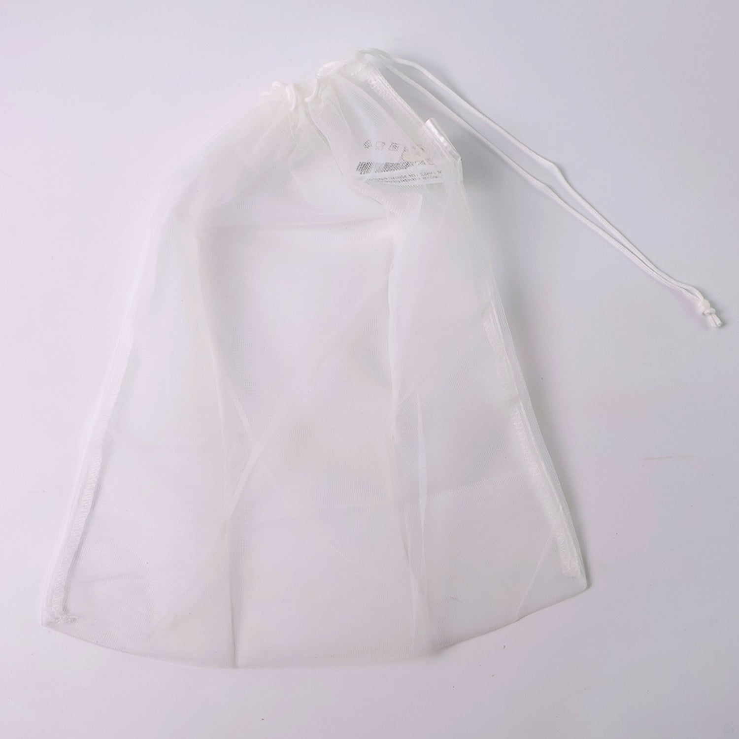 Reusable mesh storage bag showing detailed drawstring mechanism