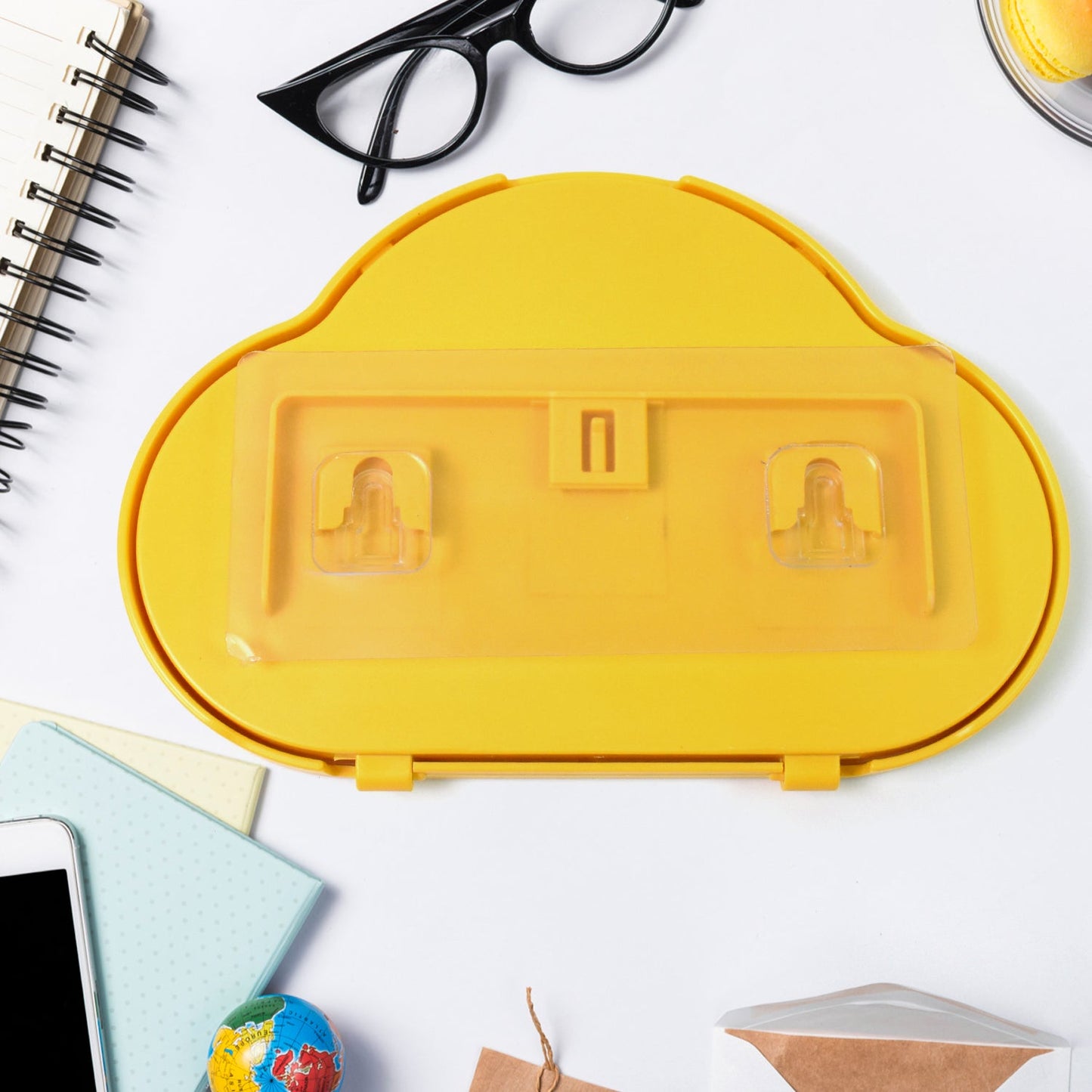 Close-up of the 360-degree rotating mechanism of the yellow wall mount phone case.
