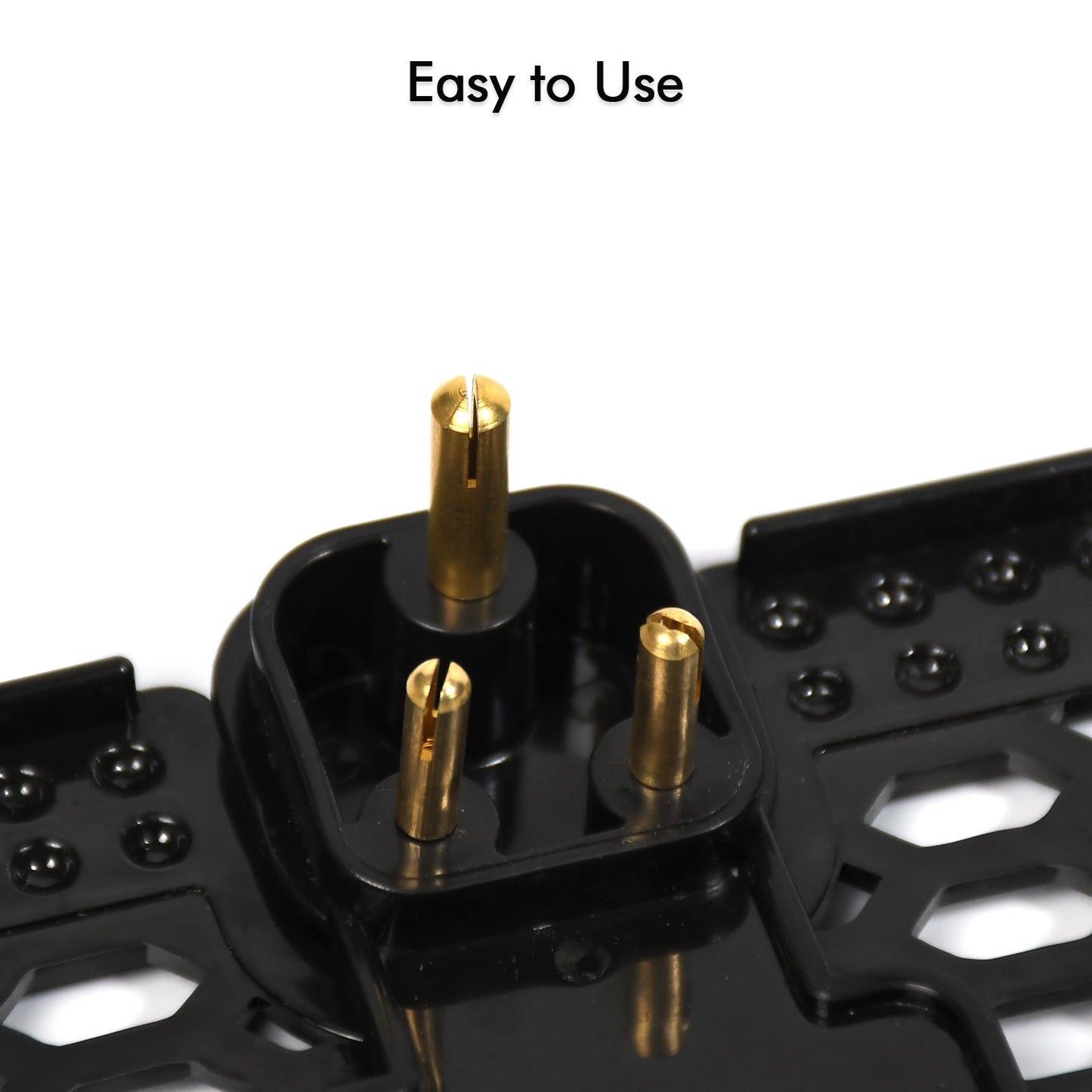 A mobile phone is securely held by the PHOBIA black wall charging stand.