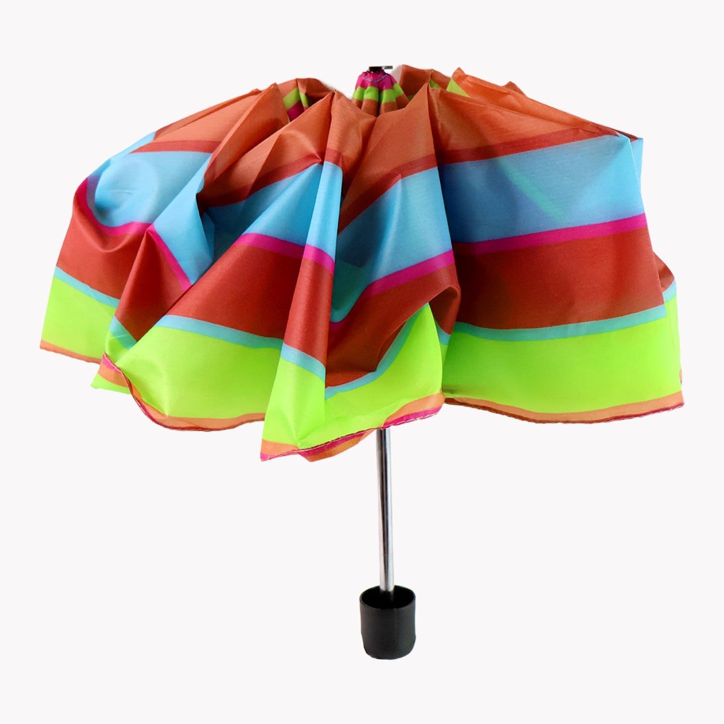 Folded umbrella placed next to backpack showing portability
