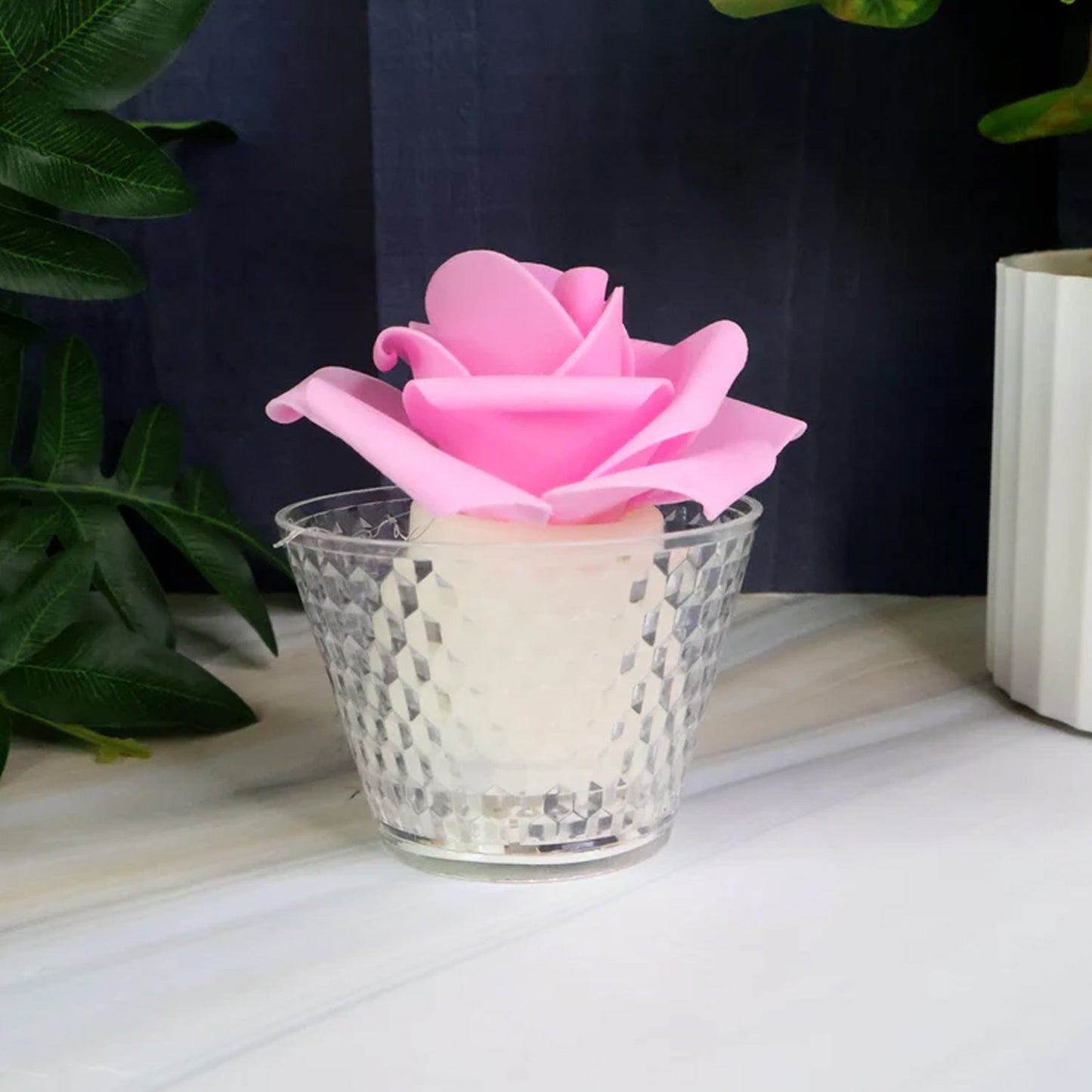 Flower-shaped flameless LED tealight candles arranged decoratively