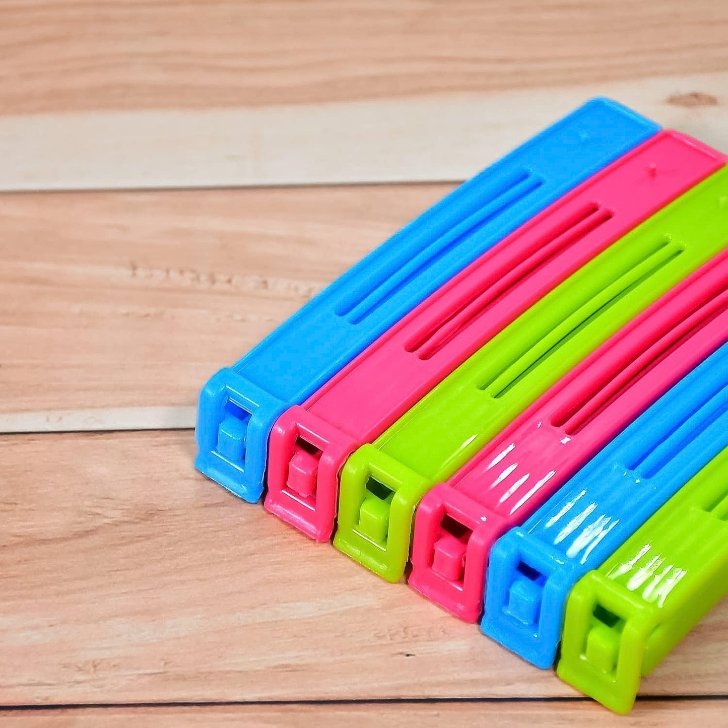 Assorted plastic pouch sealer clips in bright colors to keep food fresh