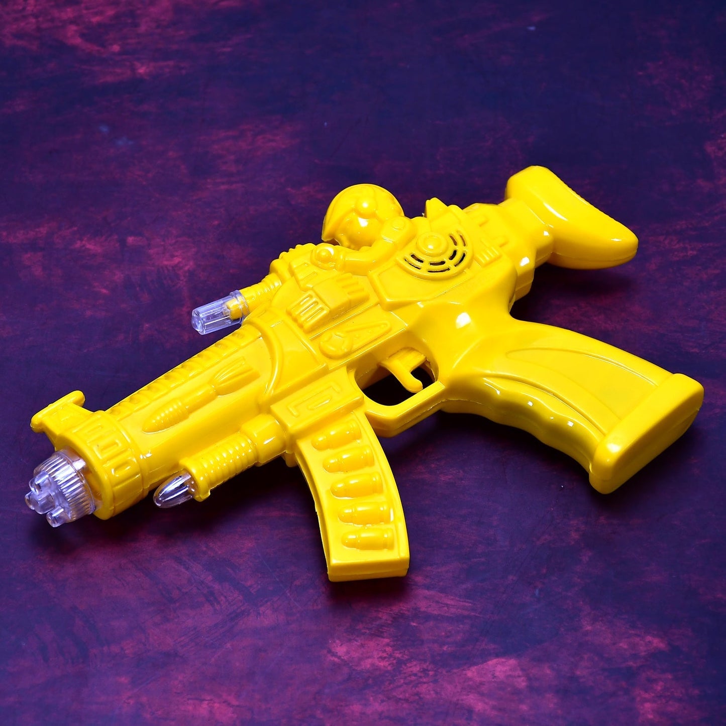 Front view of the Musical Transparent Toy Gun with glowing gears and rainbow lights.
