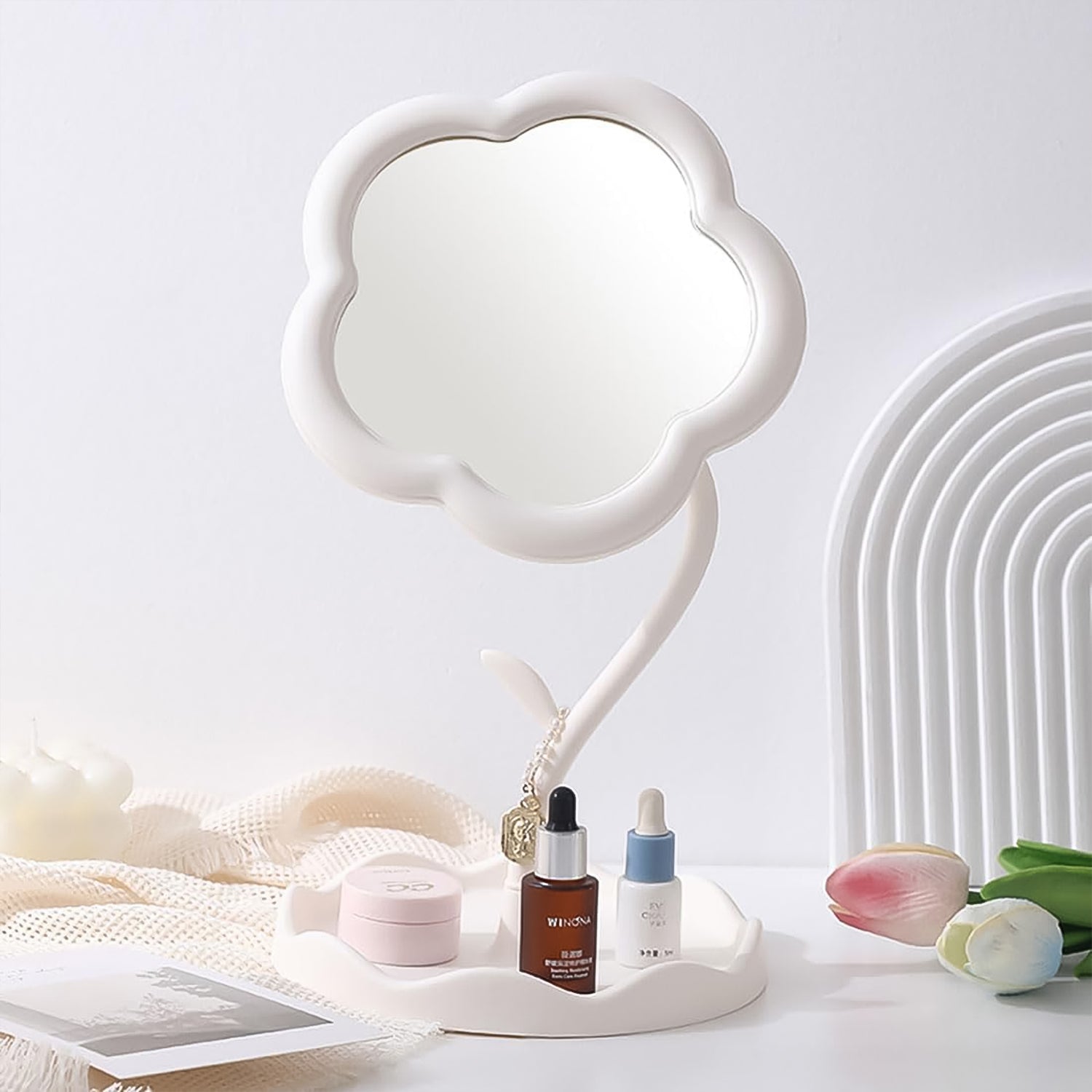 Flower vanity mirror with jewelry and small accessories stored neatly in base tray