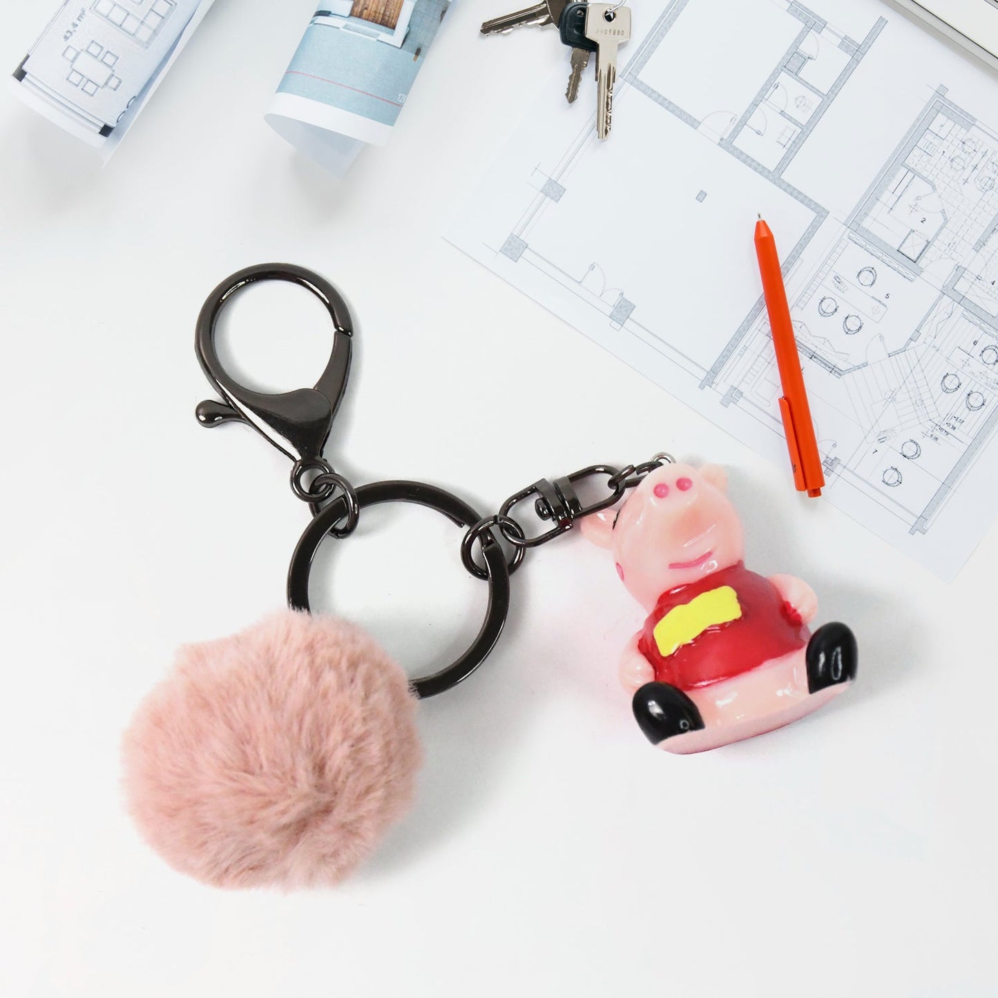 Cartoon keychain with golden ears and fluffy pom pom charmingly displayed