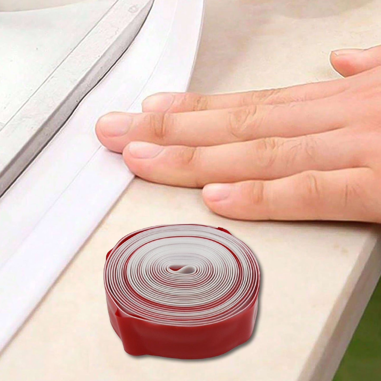 Easy-to-apply self-adhesive caulk tape protecting kitchen corners.