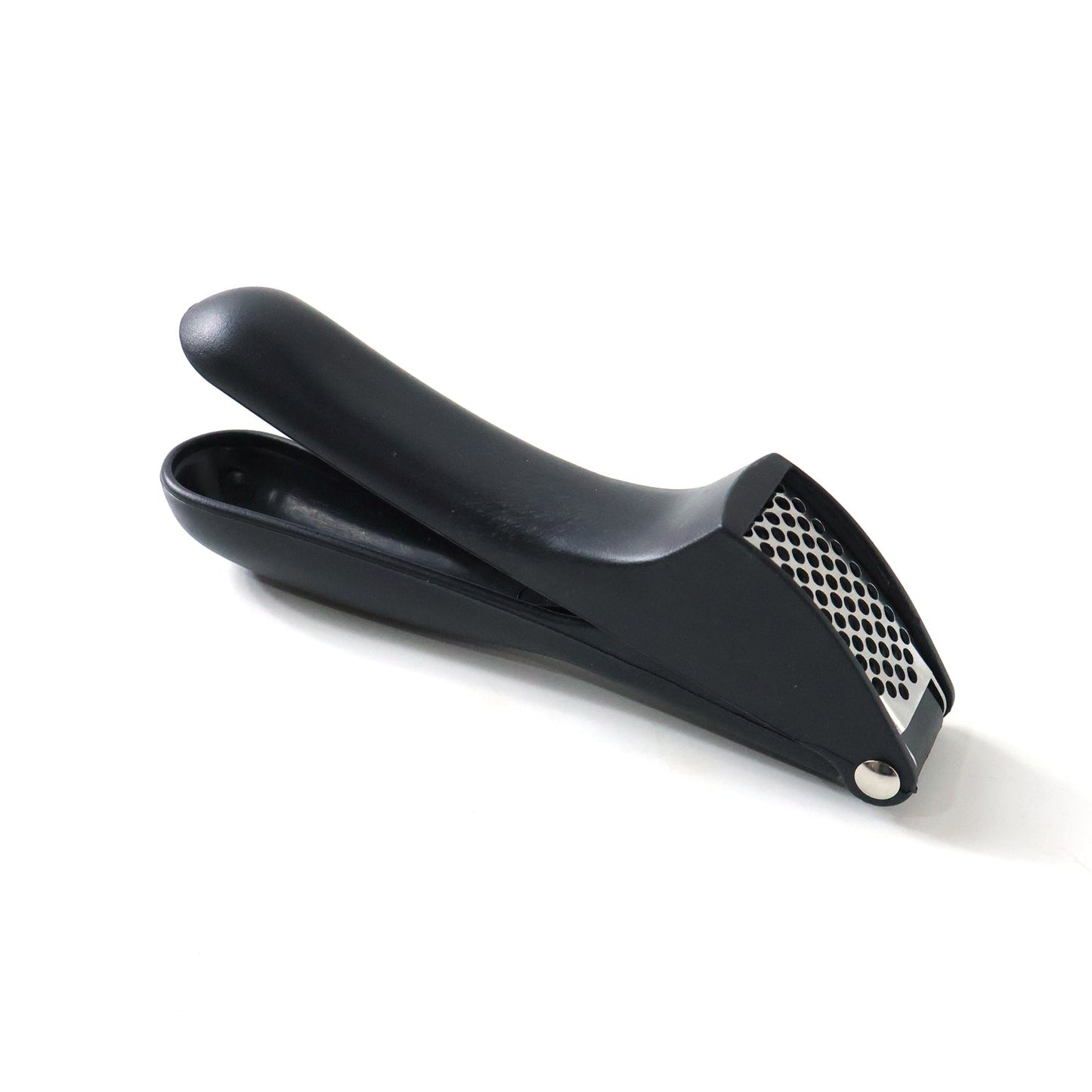 Garlic press kitchen tool placed neatly on a kitchen countertop