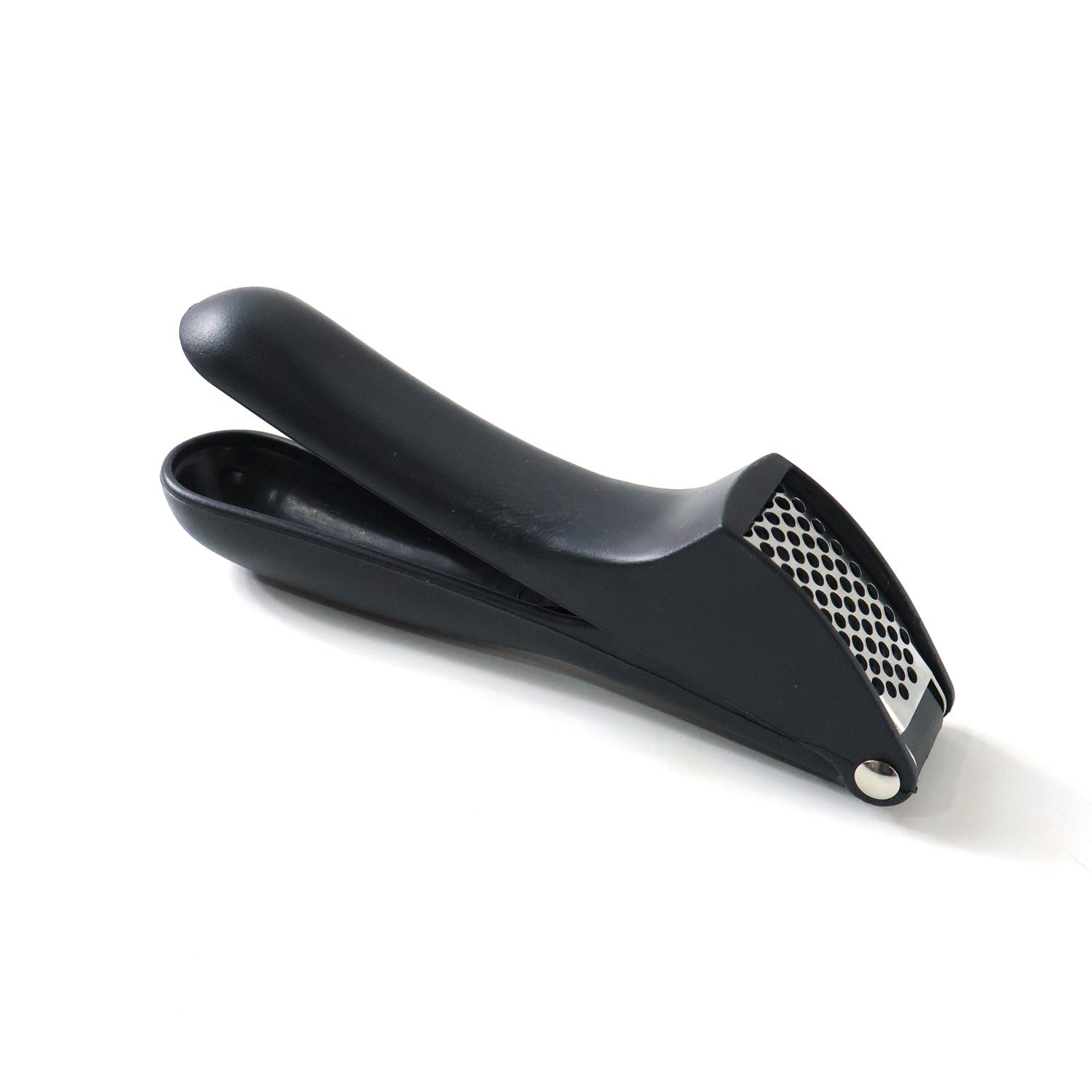 Garlic press kitchen tool placed neatly on a kitchen countertop