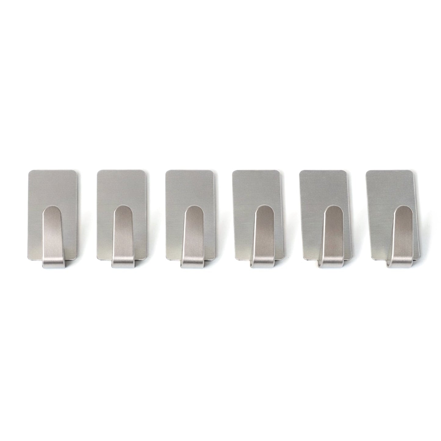Wall hooks hanging keys and towels in home setting