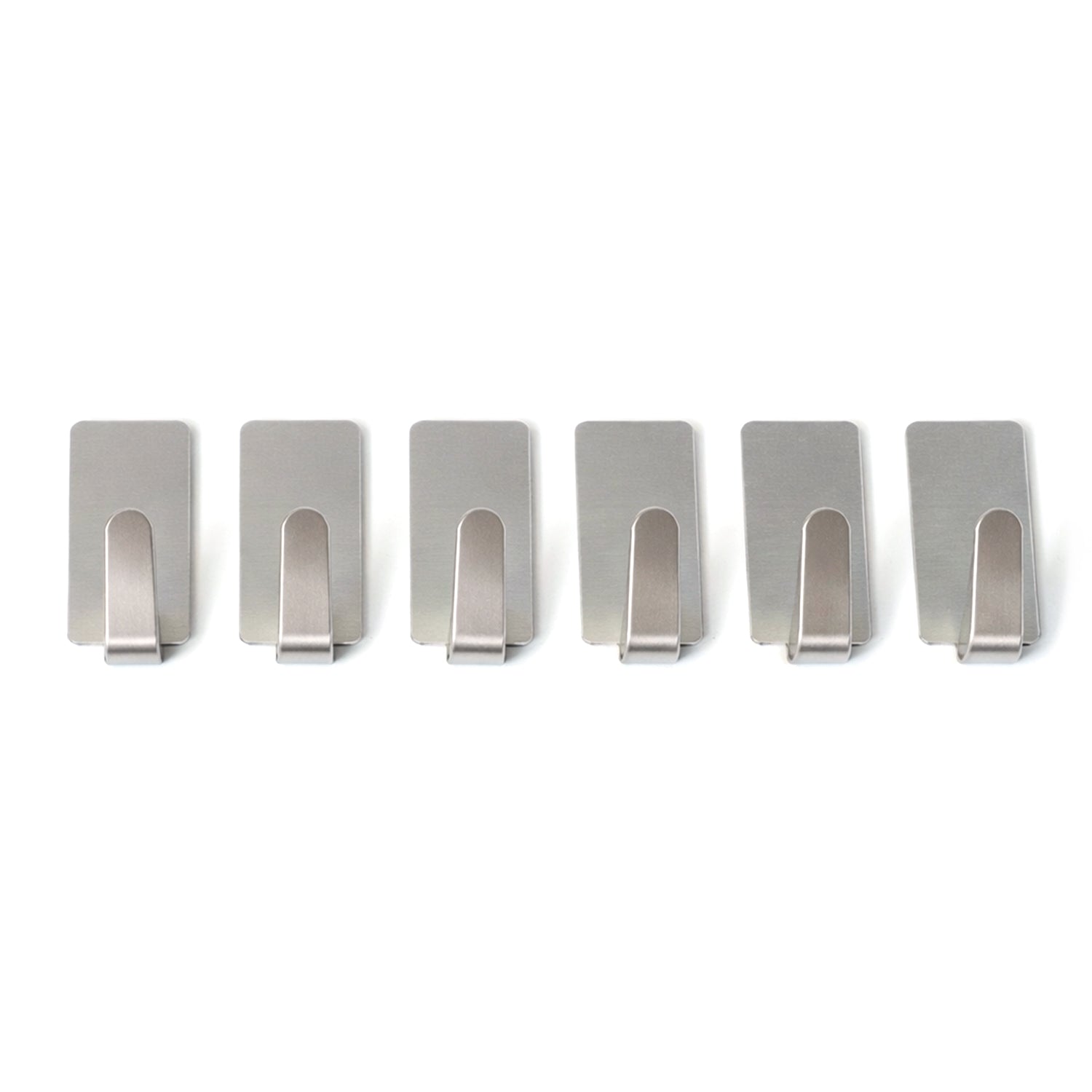 Wall hooks hanging keys and towels in home setting