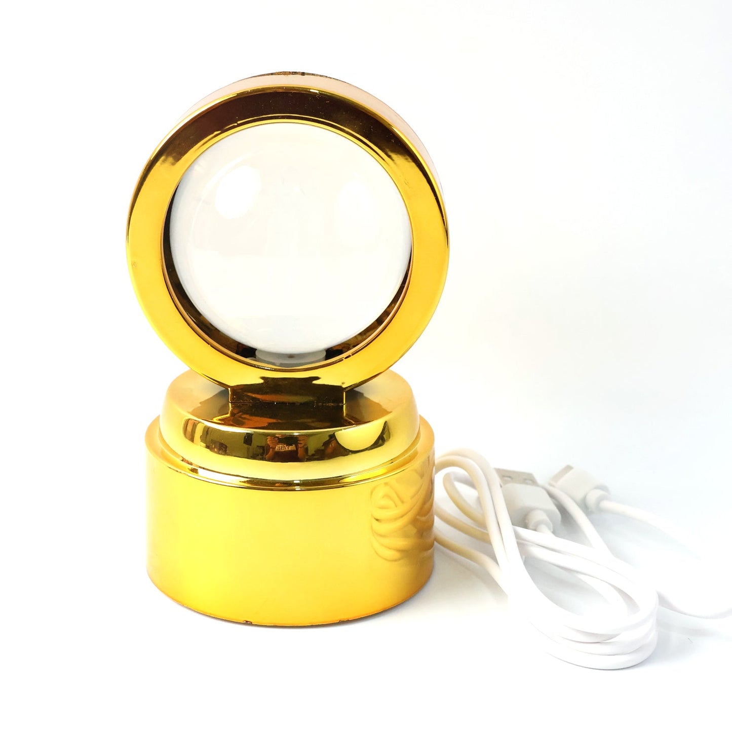 Close-up of Radhe Krishna crystal ball lamp with 360 degree rotation and warm glow