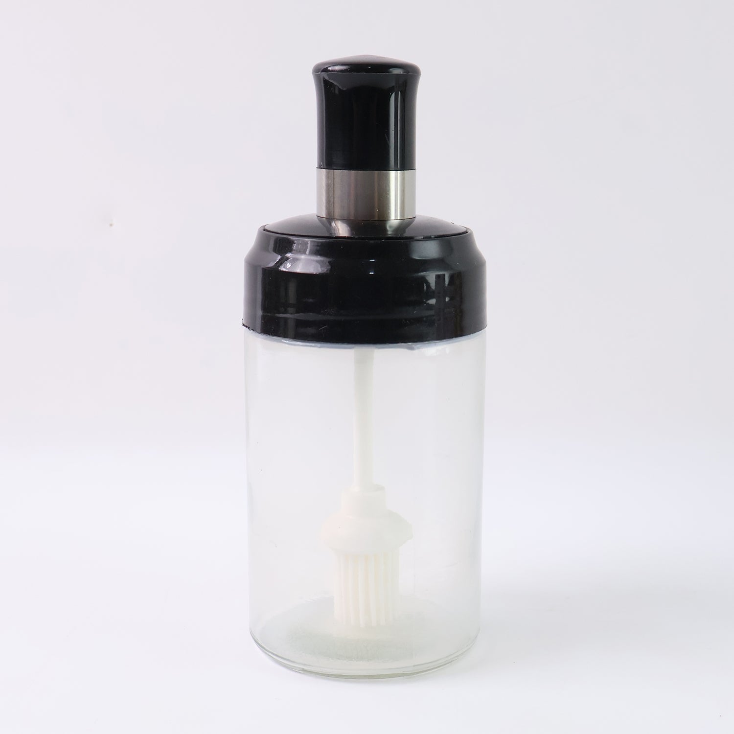 Crystal clear oil dispenser bottle featuring silicone basting brush applicator