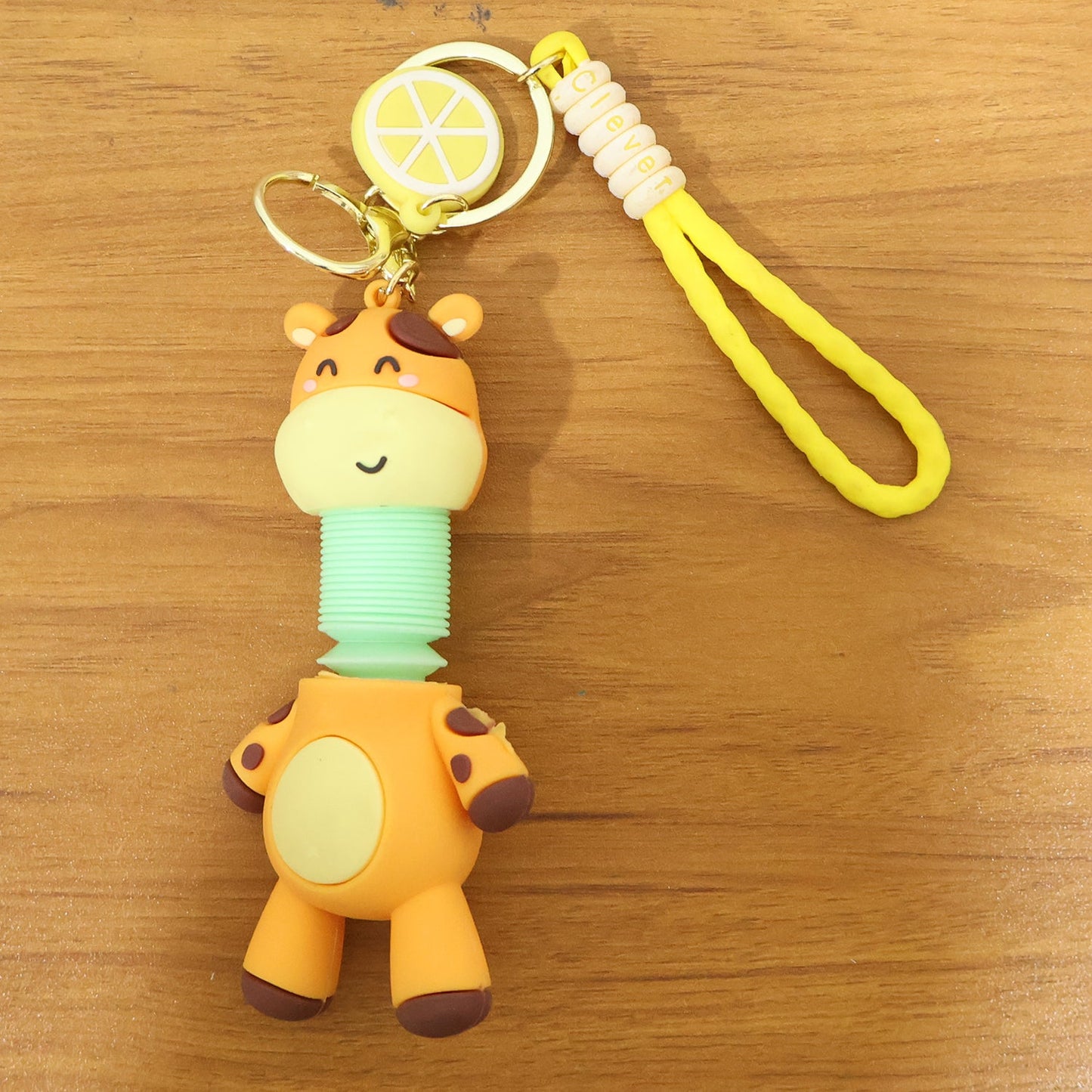 Giraffe keychain close-up showing flexible neck spring detail