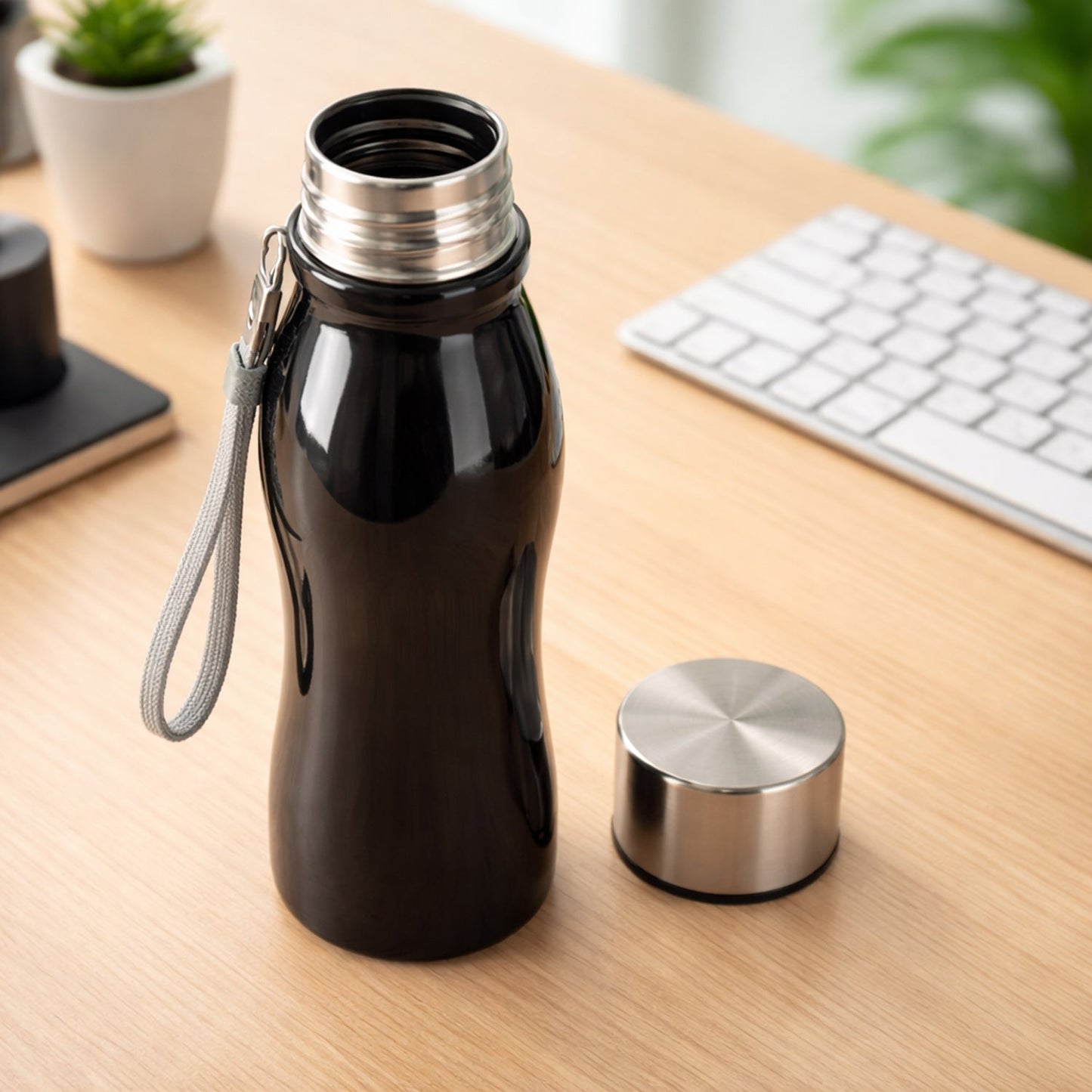 Reusable metal water bottle, showcasing its eco-friendly design.