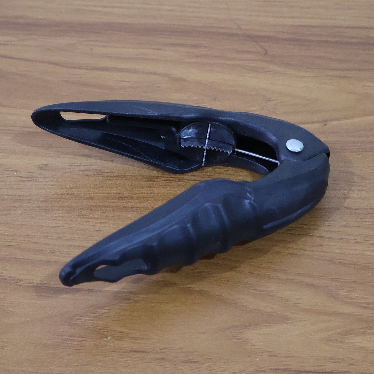 Durable handheld nut and seafood shell cracker tool
