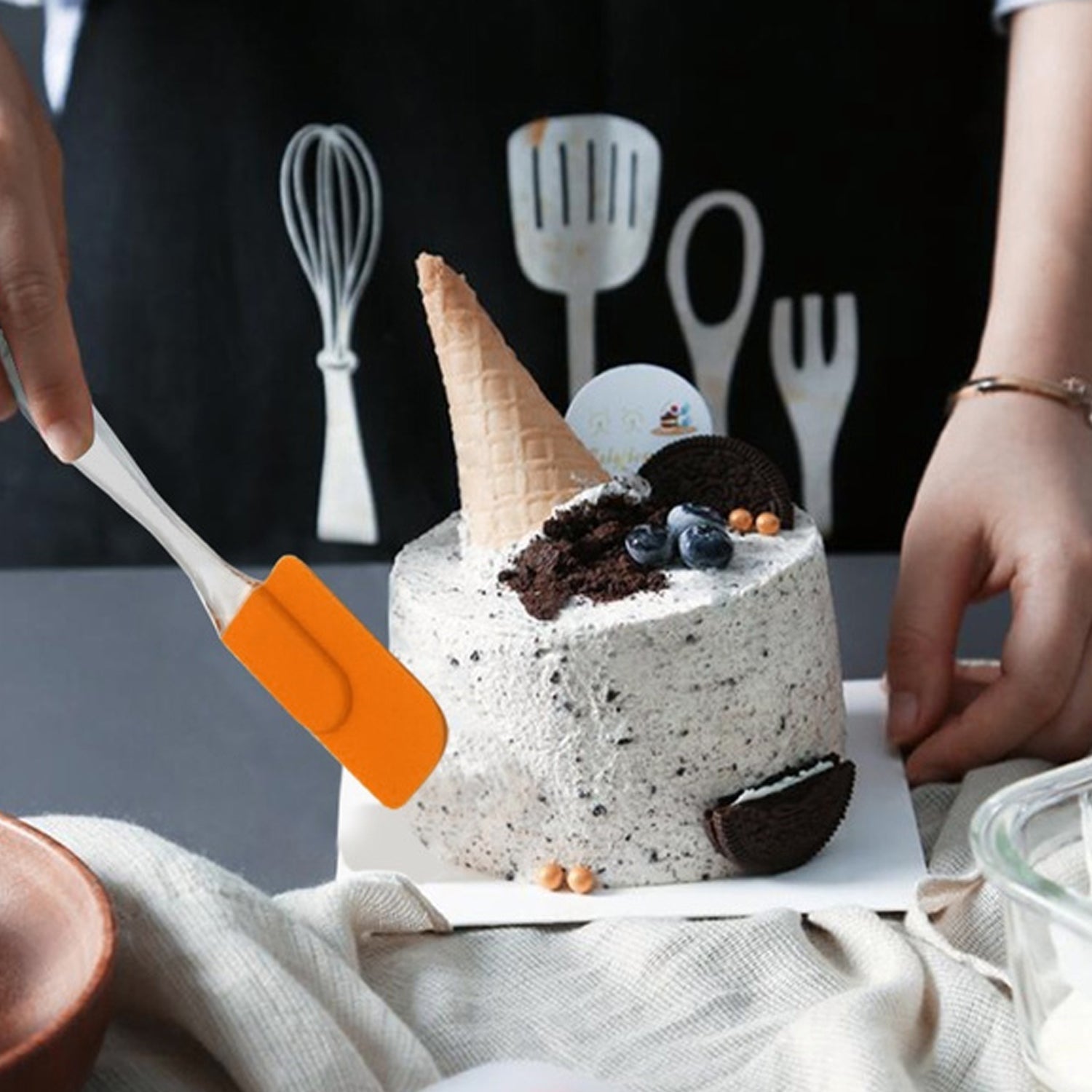 Silicone brush and spatula tools shown in use for mixing cake batter.