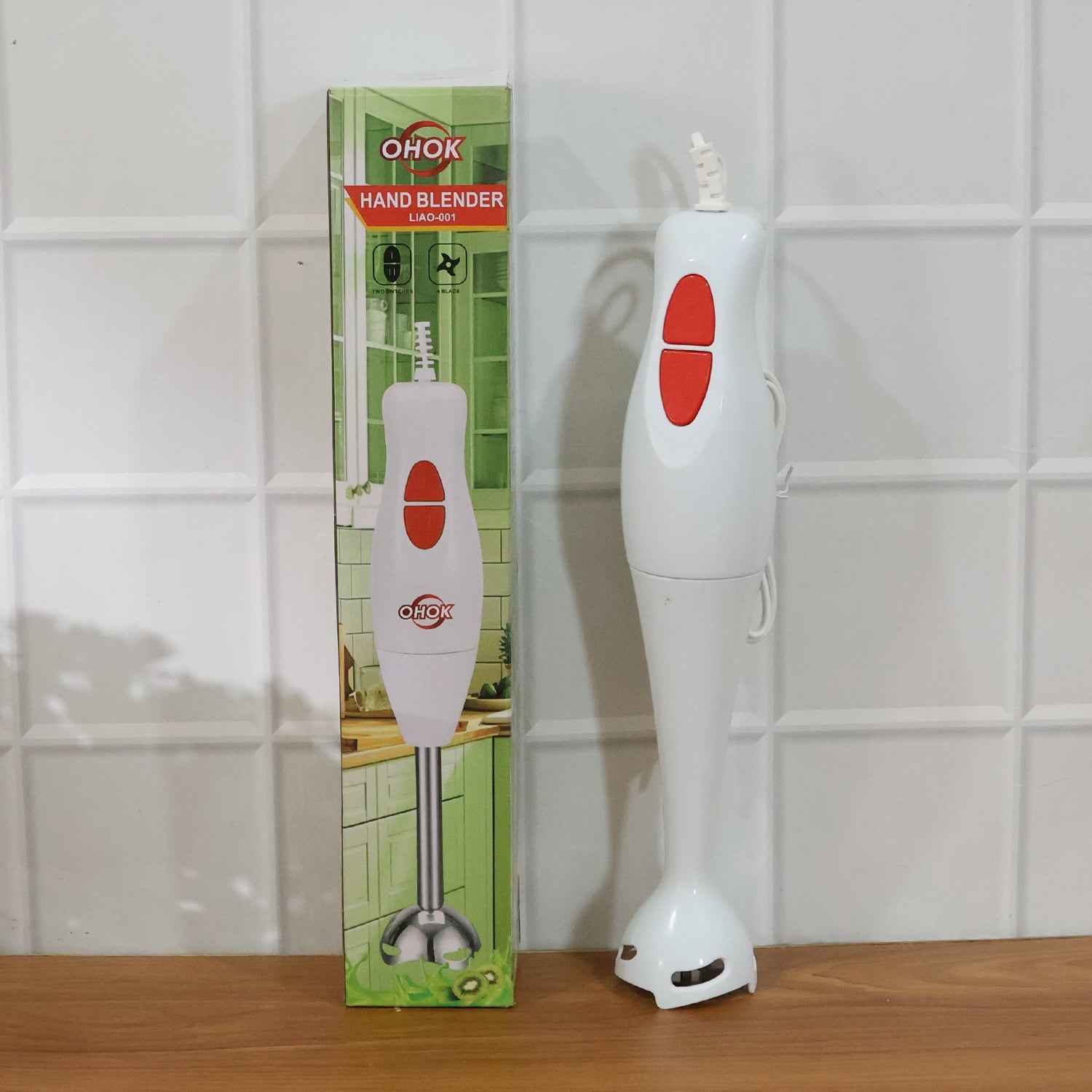 Electric hand blender stick placed on kitchen counter for use