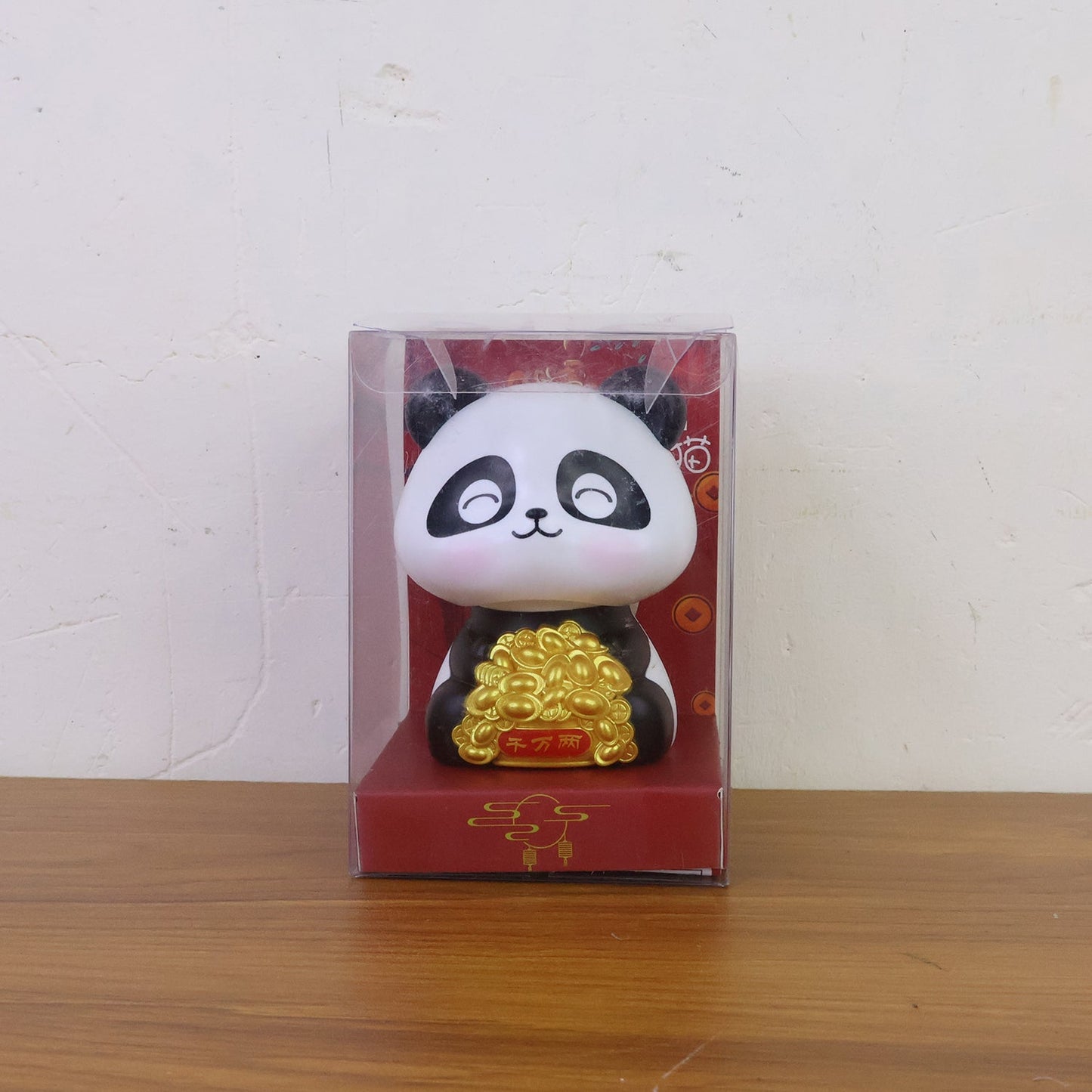 Multiple solar panda figurines in various poses, emphasizing their charm as car interior accessories.